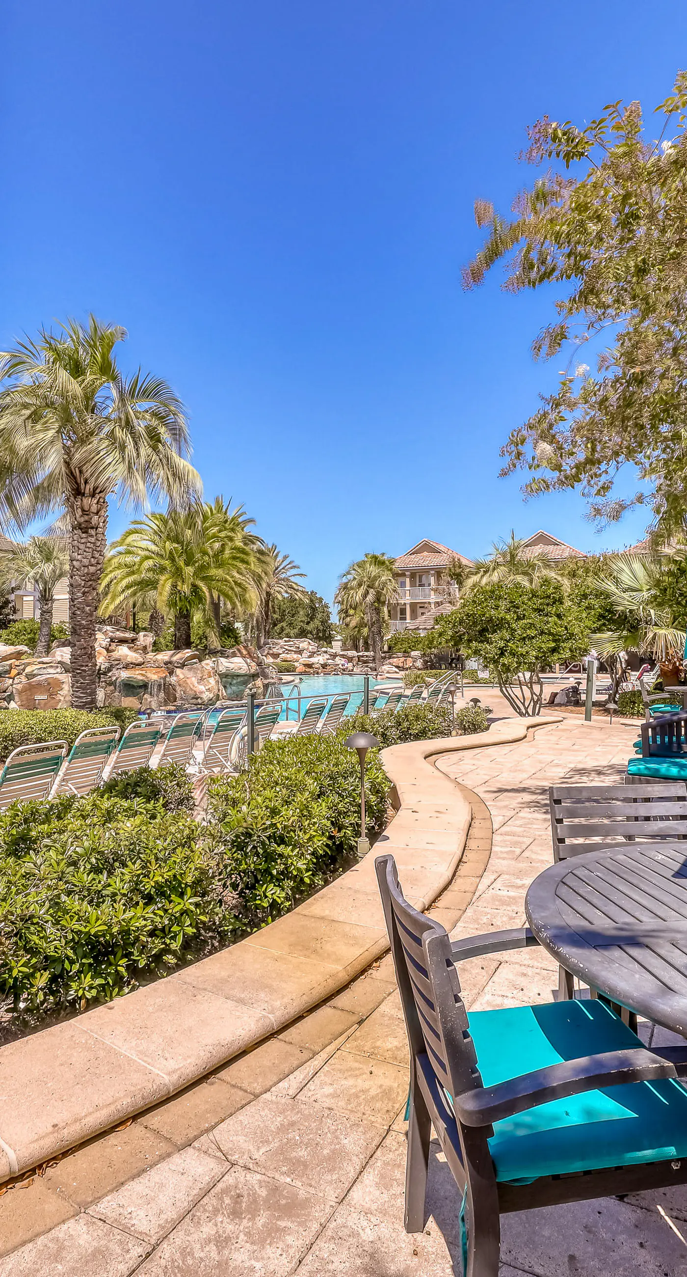 Dog-friendly home near beach with pool access, two balconies, wet bar, & W/D