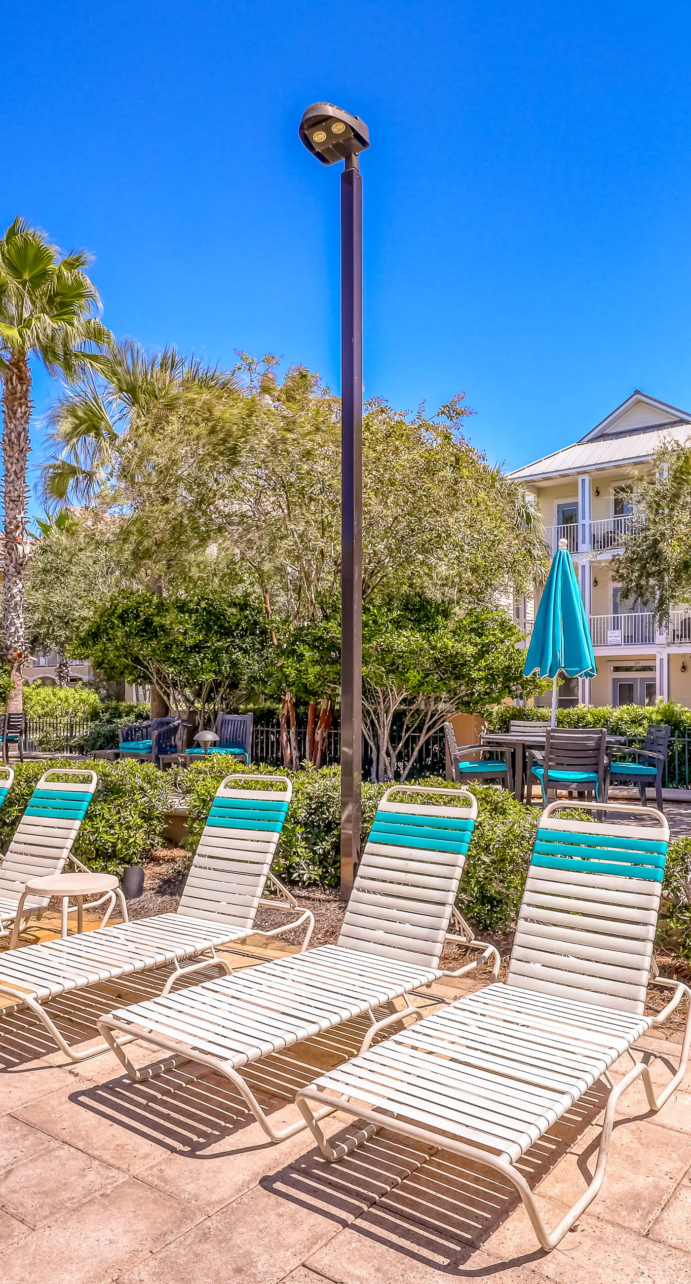 Dog-friendly home near beach with pool access, two balconies, wet bar, & W/D