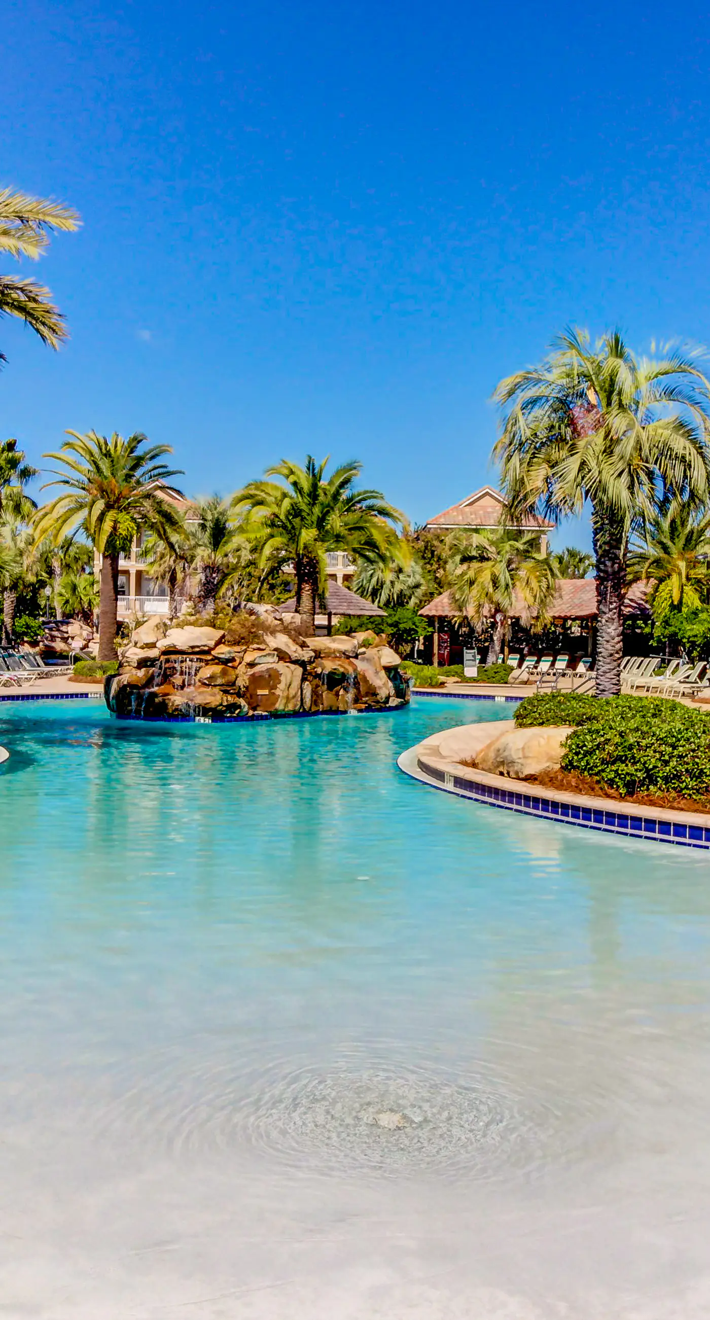 Dog-friendly home near beach with pool access, two balconies, wet bar, & W/D