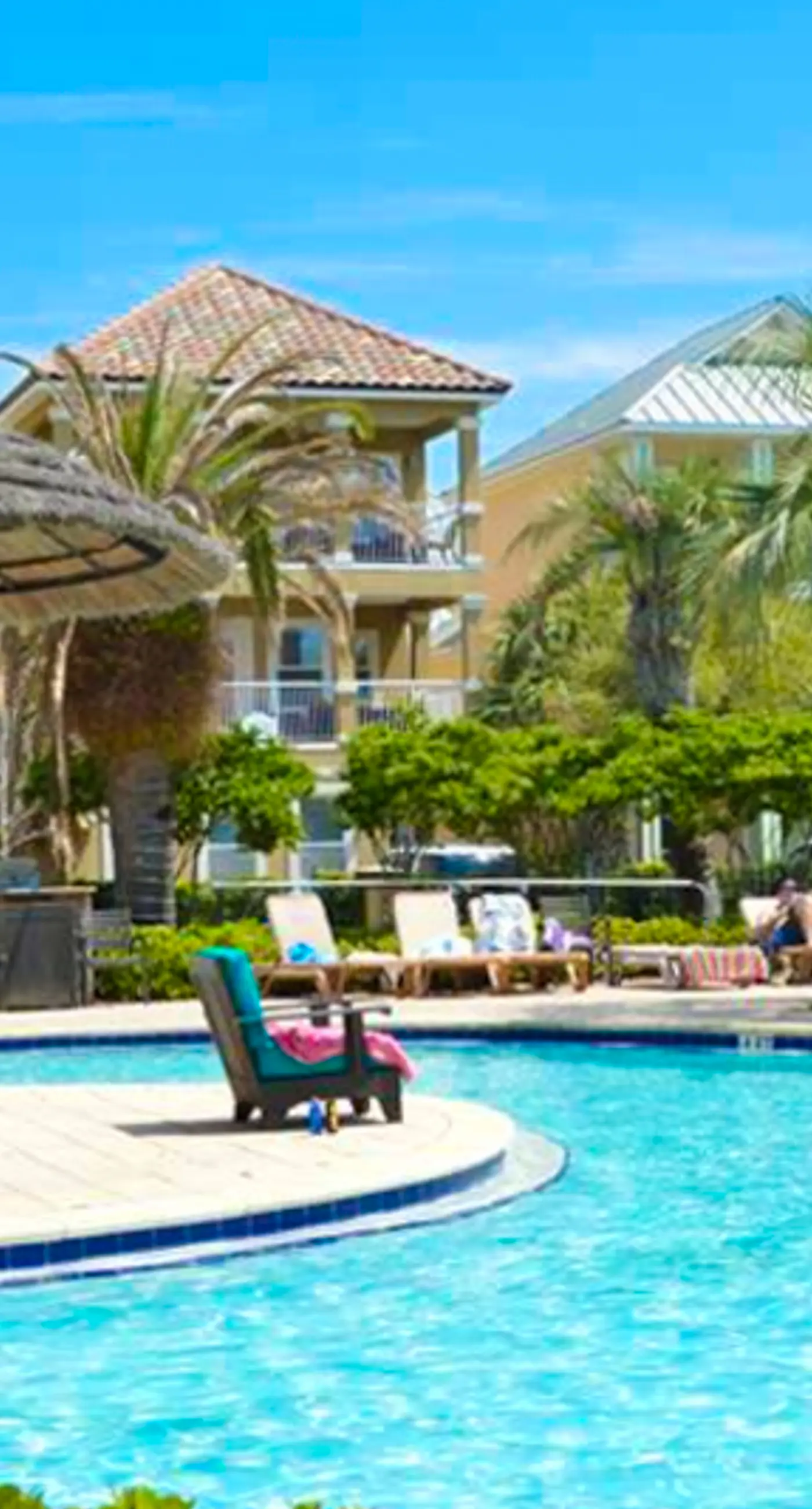 Dog-friendly home near beach with pool access, two balconies, wet bar, & W/D