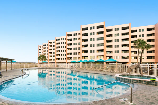 Water-view condo with heated pool, hot tub, sports courts & on-site beach access