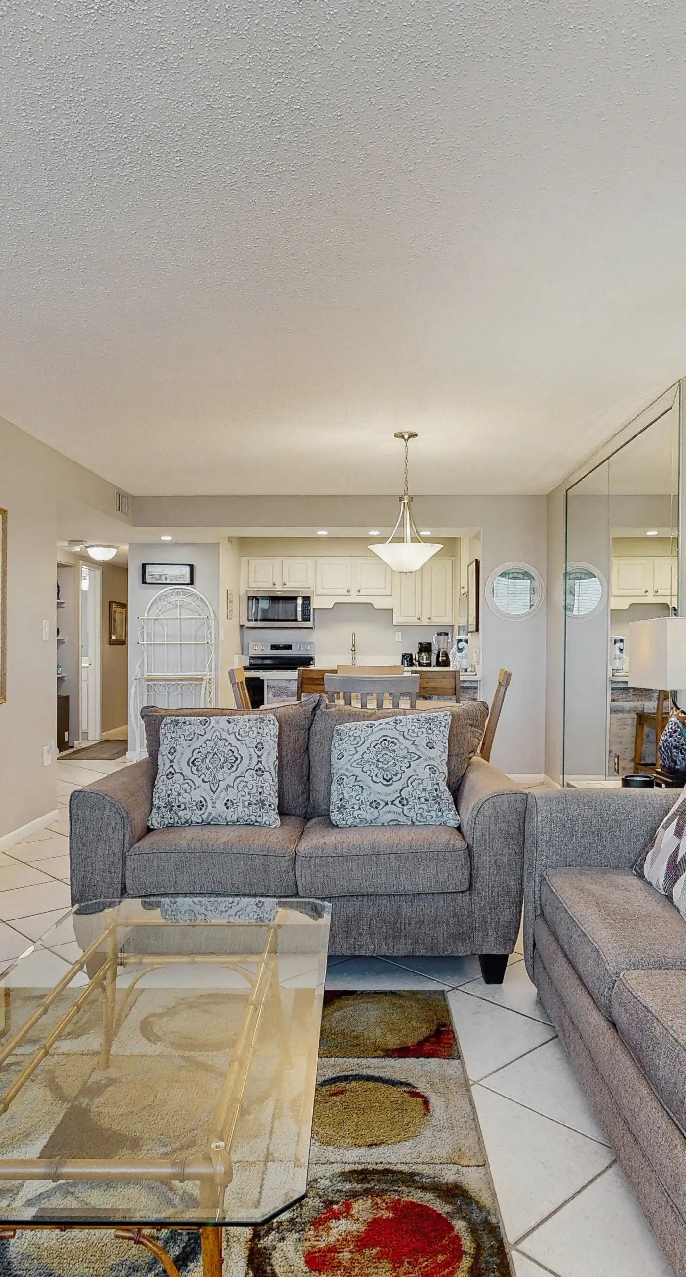 Water-view condo with heated pool, hot tub, sports courts & on-site beach access