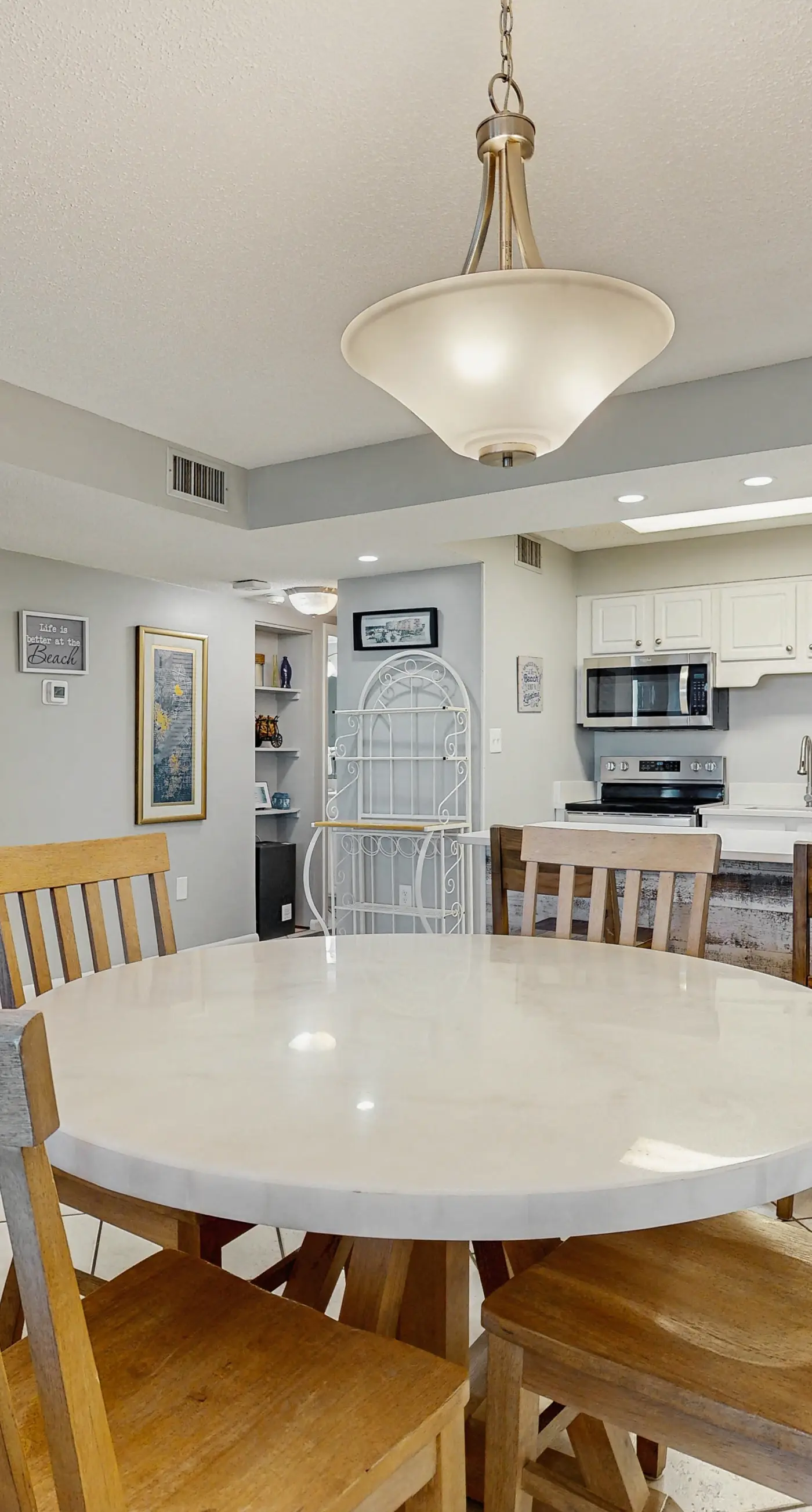 Water-view condo with heated pool, hot tub, sports courts & on-site beach access