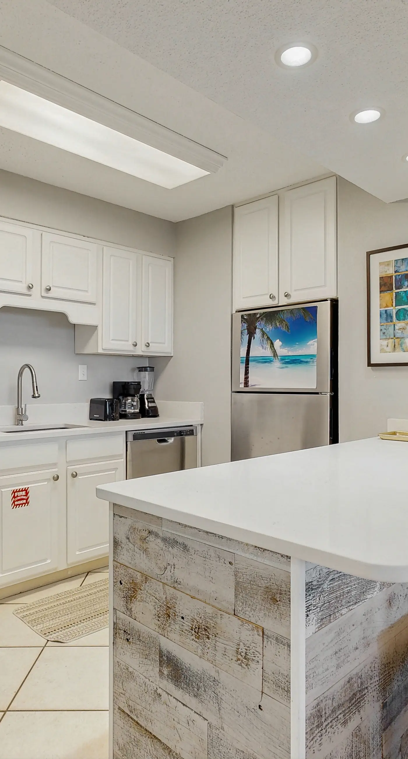 Water-view condo with heated pool, hot tub, sports courts & on-site beach access