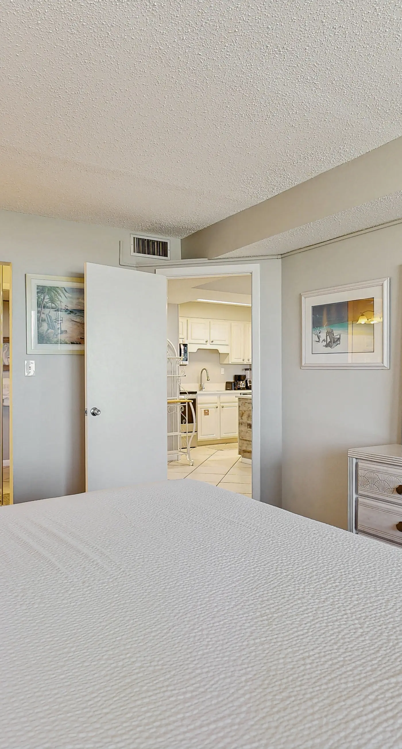 Water-view condo with heated pool, hot tub, sports courts & on-site beach access