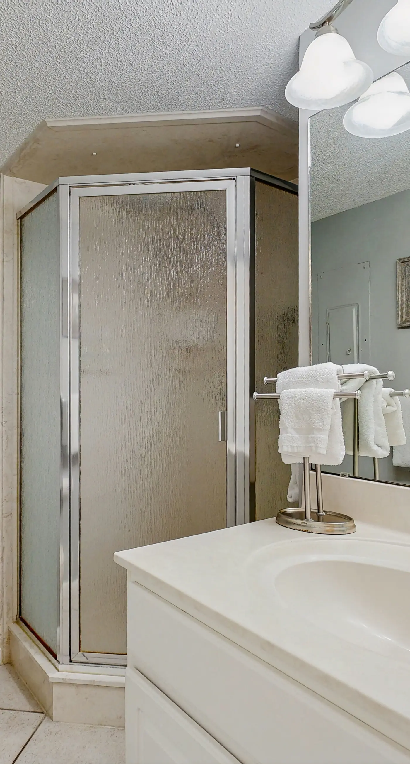 Water-view condo with heated pool, hot tub, sports courts & on-site beach access