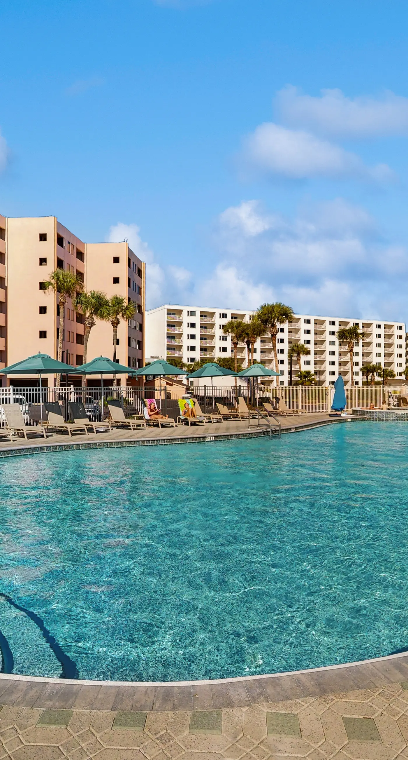 Water-view condo with heated pool, hot tub, sports courts & on-site beach access