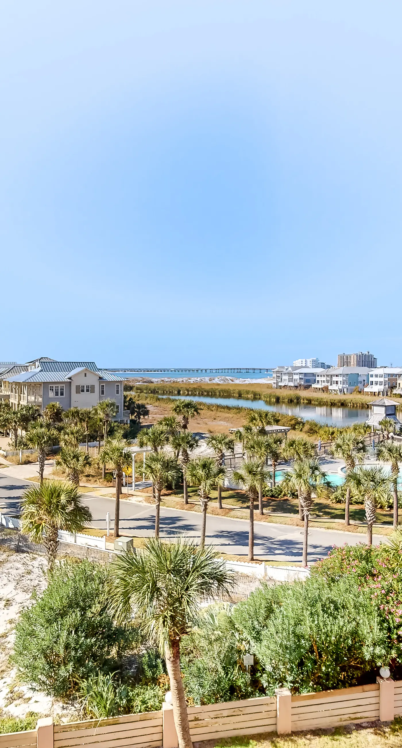 Water-view condo with heated pool, hot tub, sports courts & on-site beach access