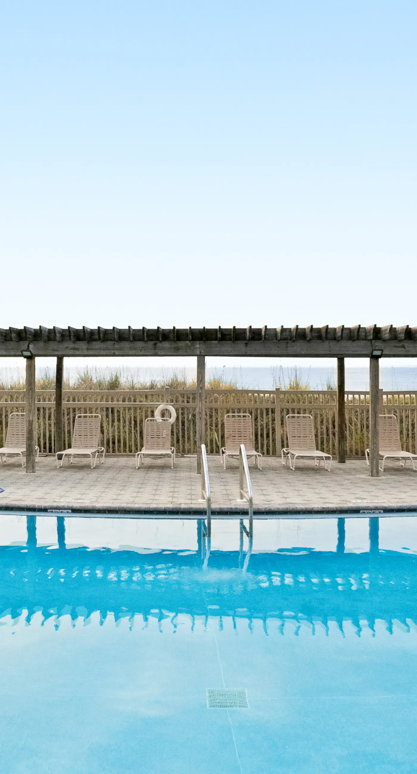 Water-view condo with heated pool, hot tub, sports courts & on-site beach access