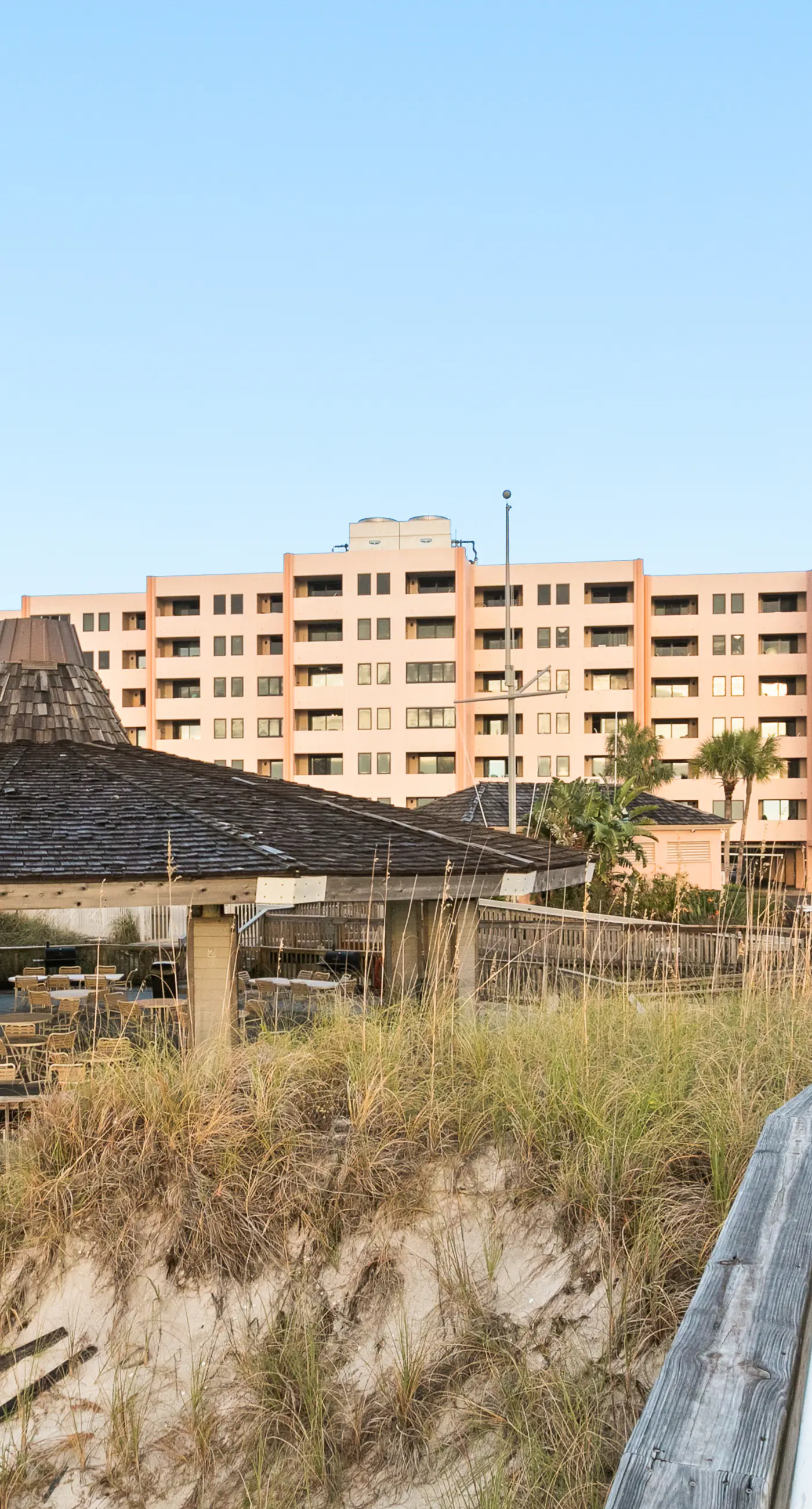 Water-view condo with heated pool, hot tub, sports courts & on-site beach access