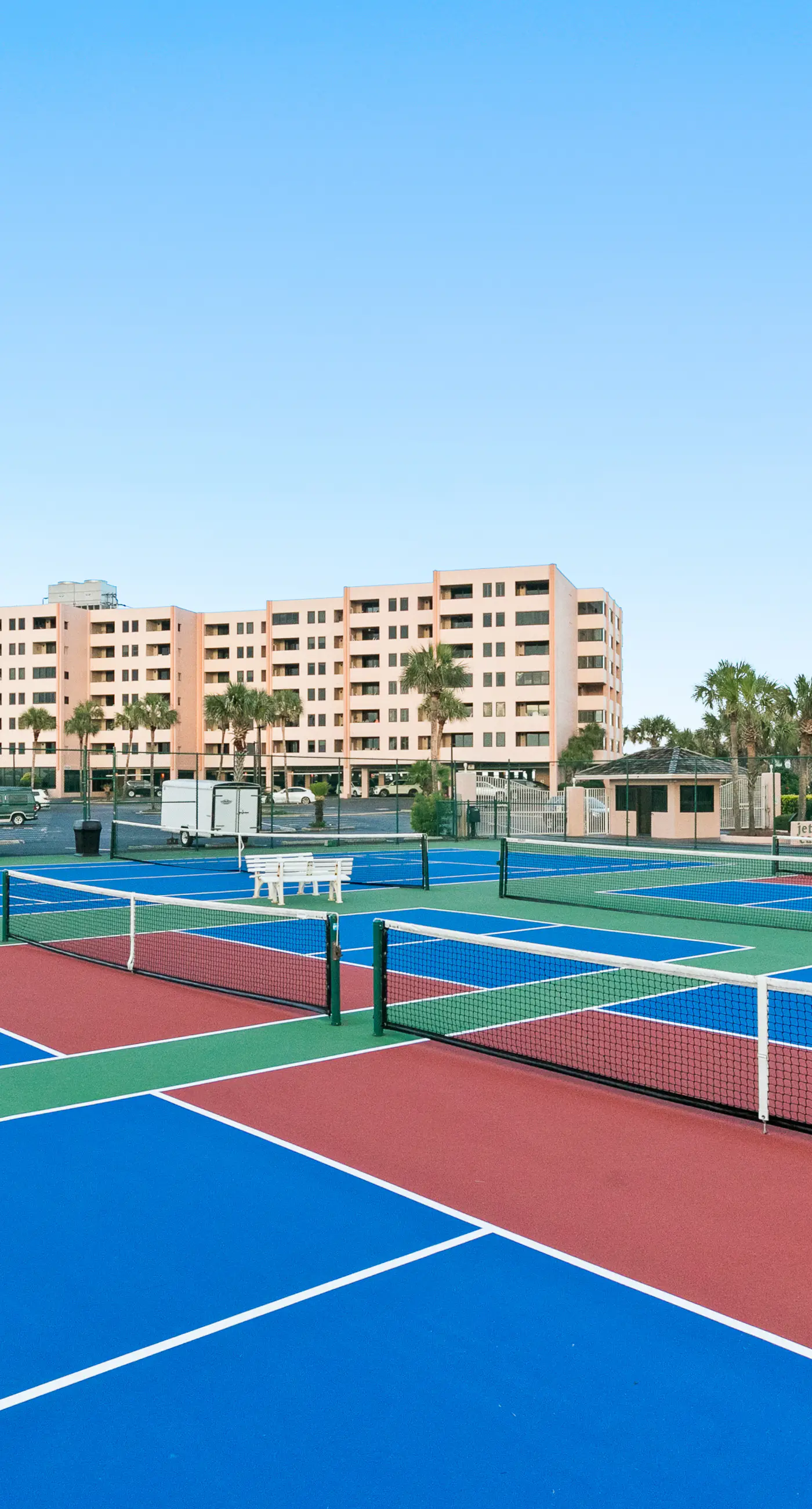 Water-view condo with heated pool, hot tub, sports courts & on-site beach access