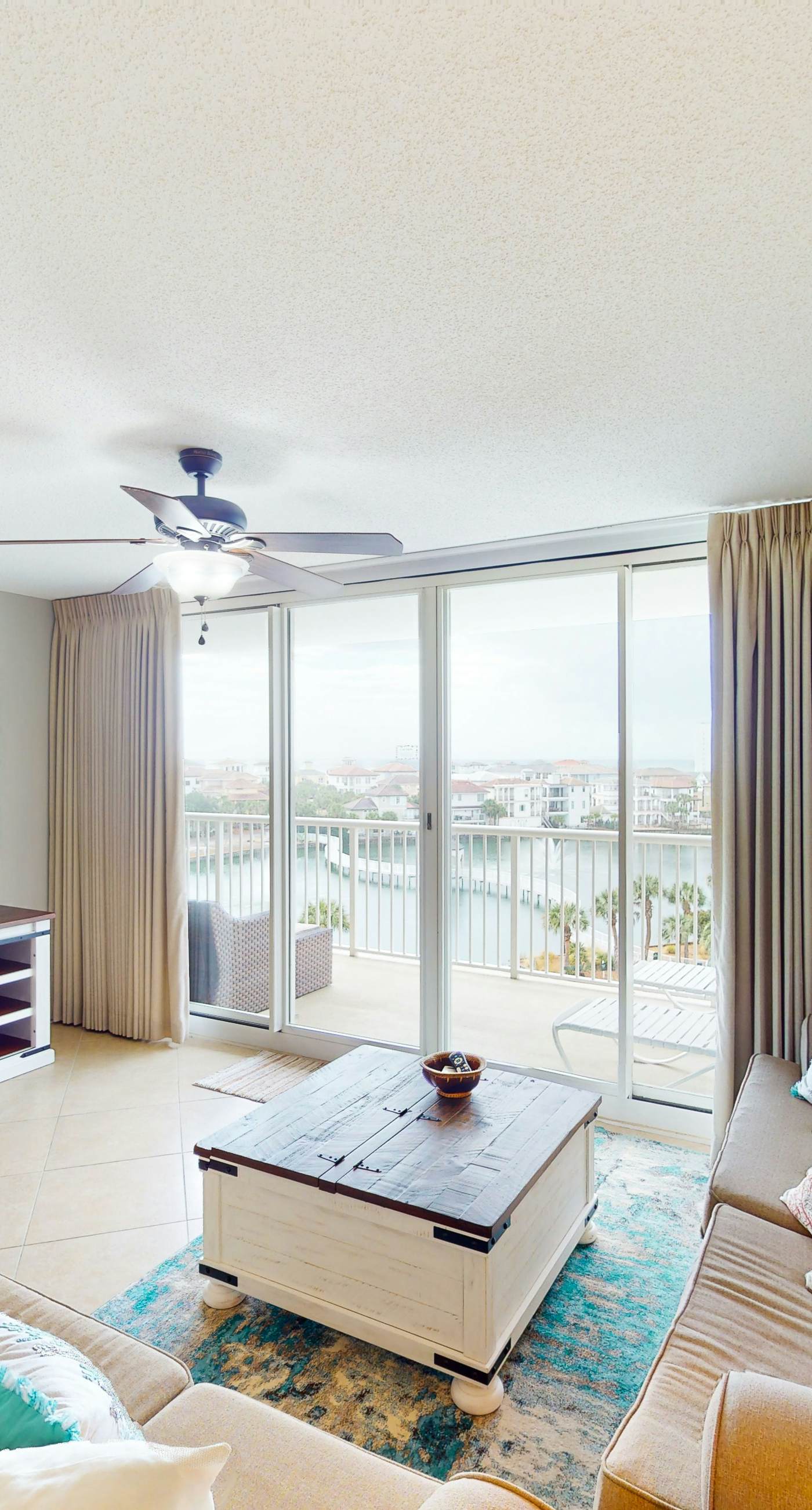Lake-view 5th-floor resort condo with outdoor pool, gym, balcony, & washer/dryer