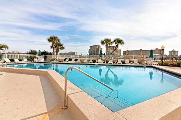 1st-floor condo near the beach with outdoor pool, tennis court & furnished patio