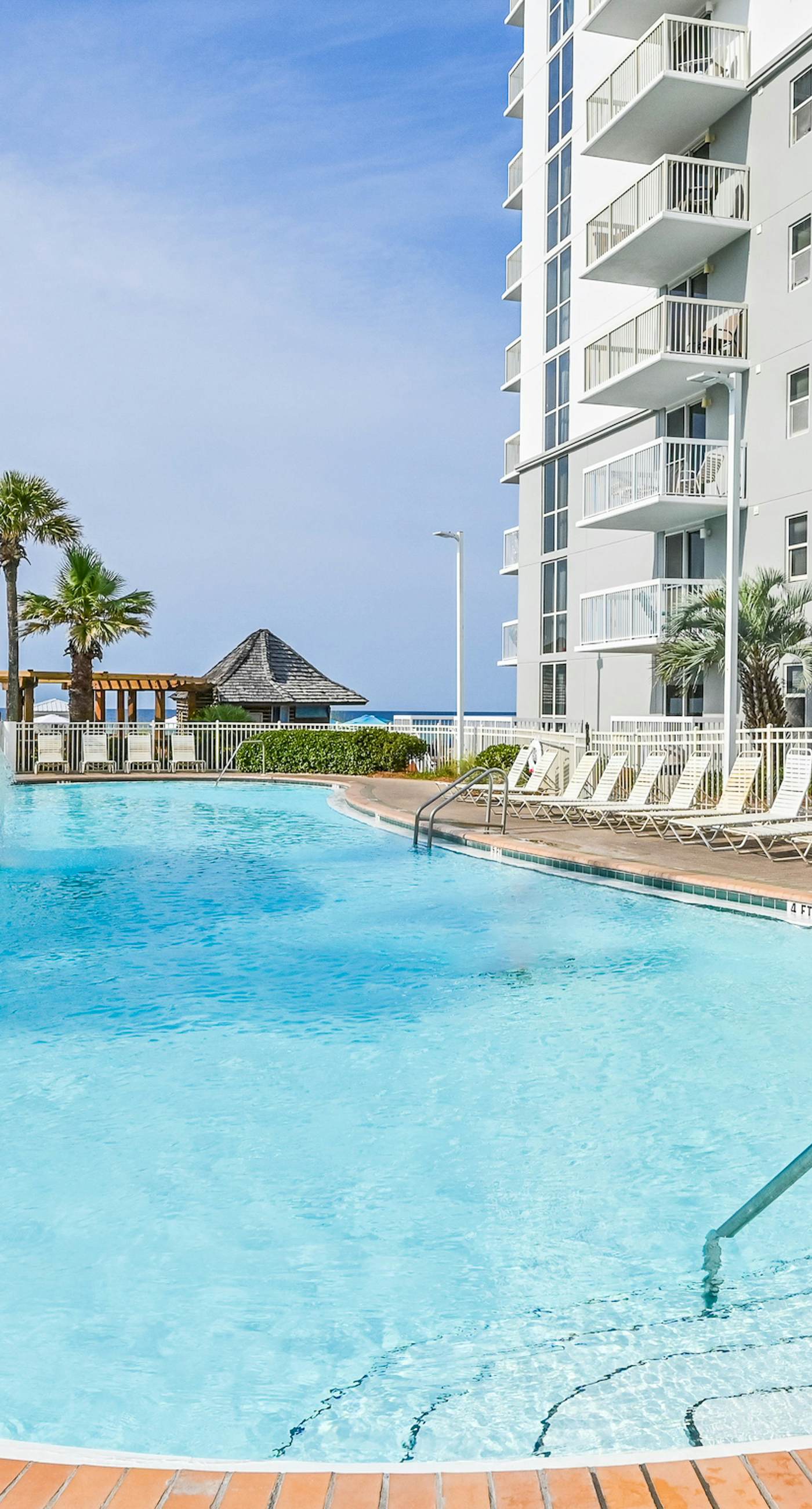 Gulf-front condo with pools, hot tubs, gym, beach access & scenic balcony