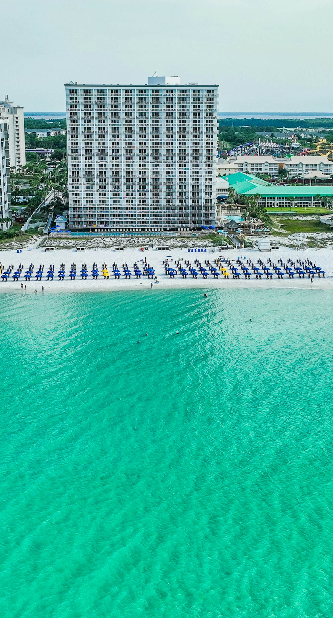 Gulf-front condo with pools, hot tubs, gym, beach access & scenic balcony