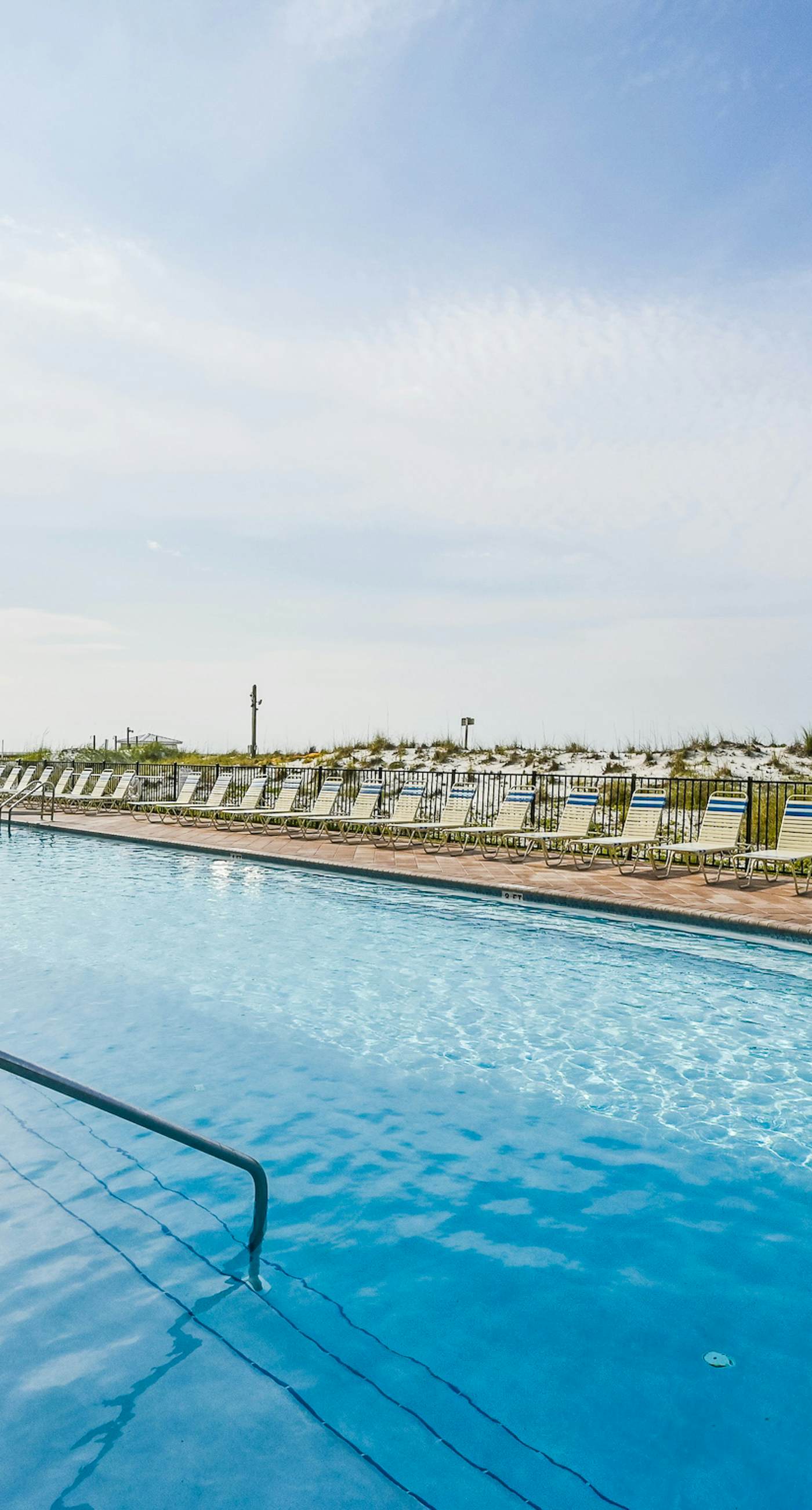 Gulf-front condo with pools, hot tubs, gym, beach access & scenic balcony