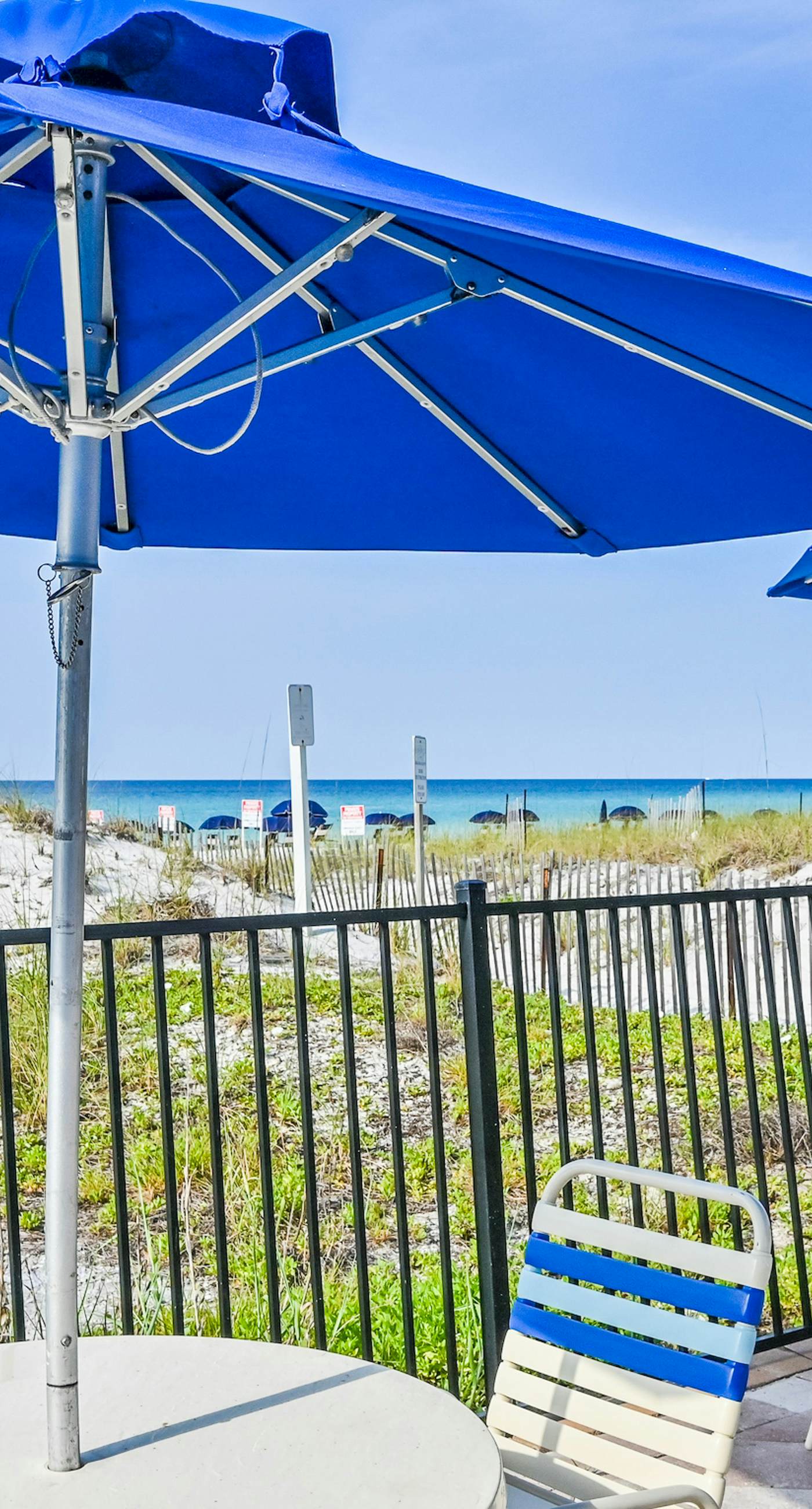 Gulf-front condo with pools, hot tubs, gym, beach access & scenic balcony