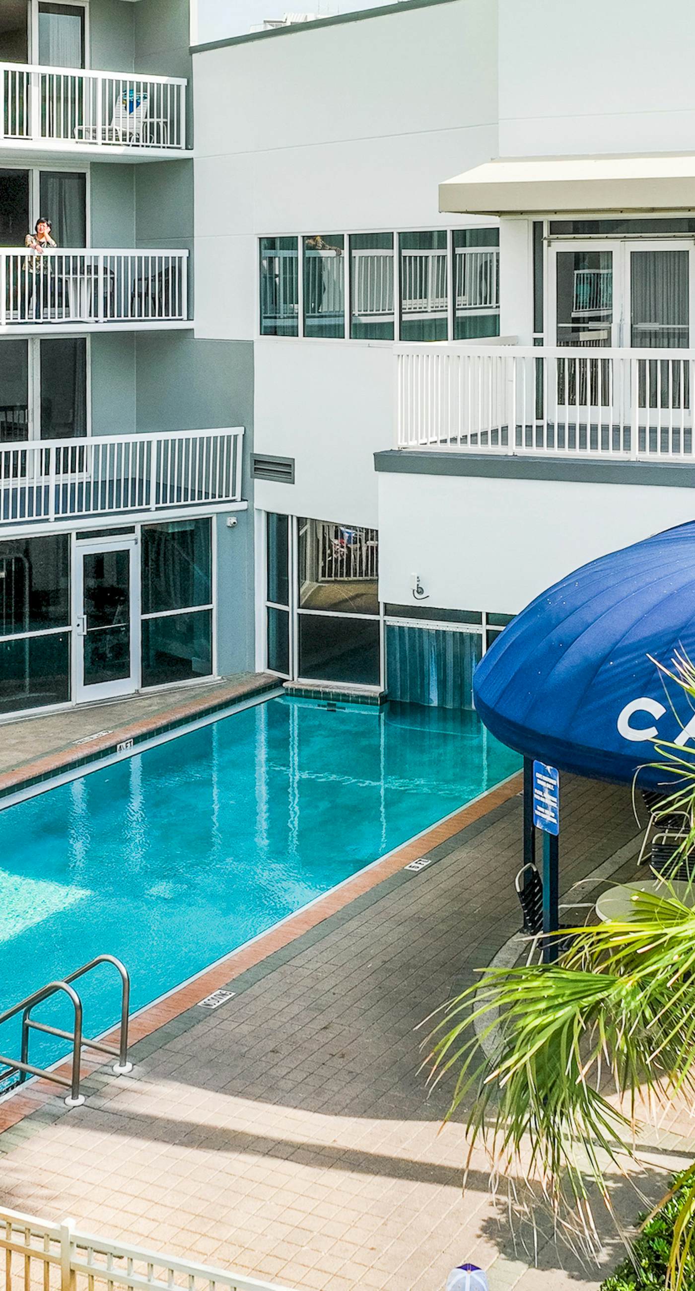 Gulf-front condo with pools, hot tubs, gym, beach access & scenic balcony