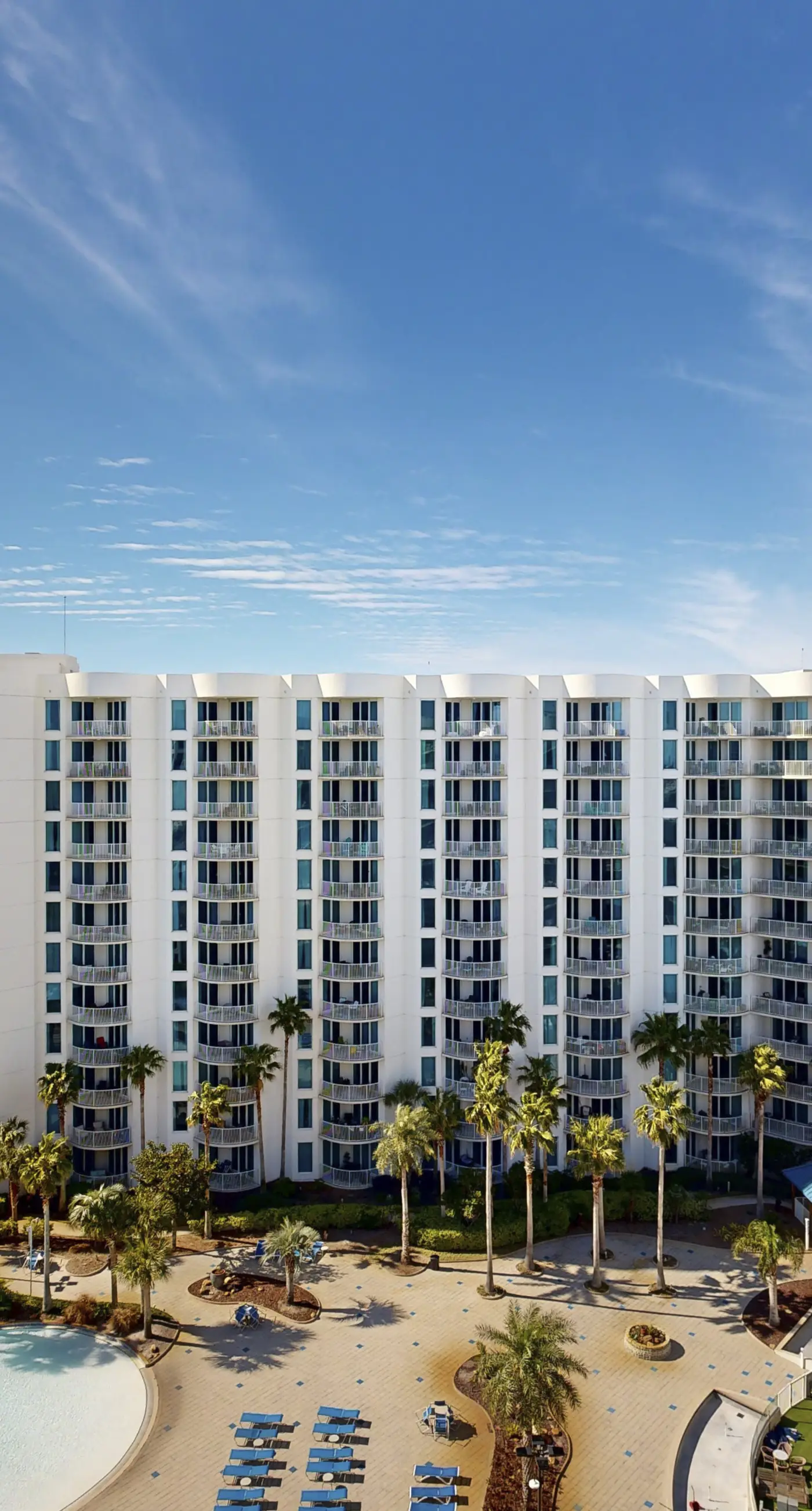 Water-view 11th-floor condo with hot tub, heated pool, tennis, sauna, gym, W/D