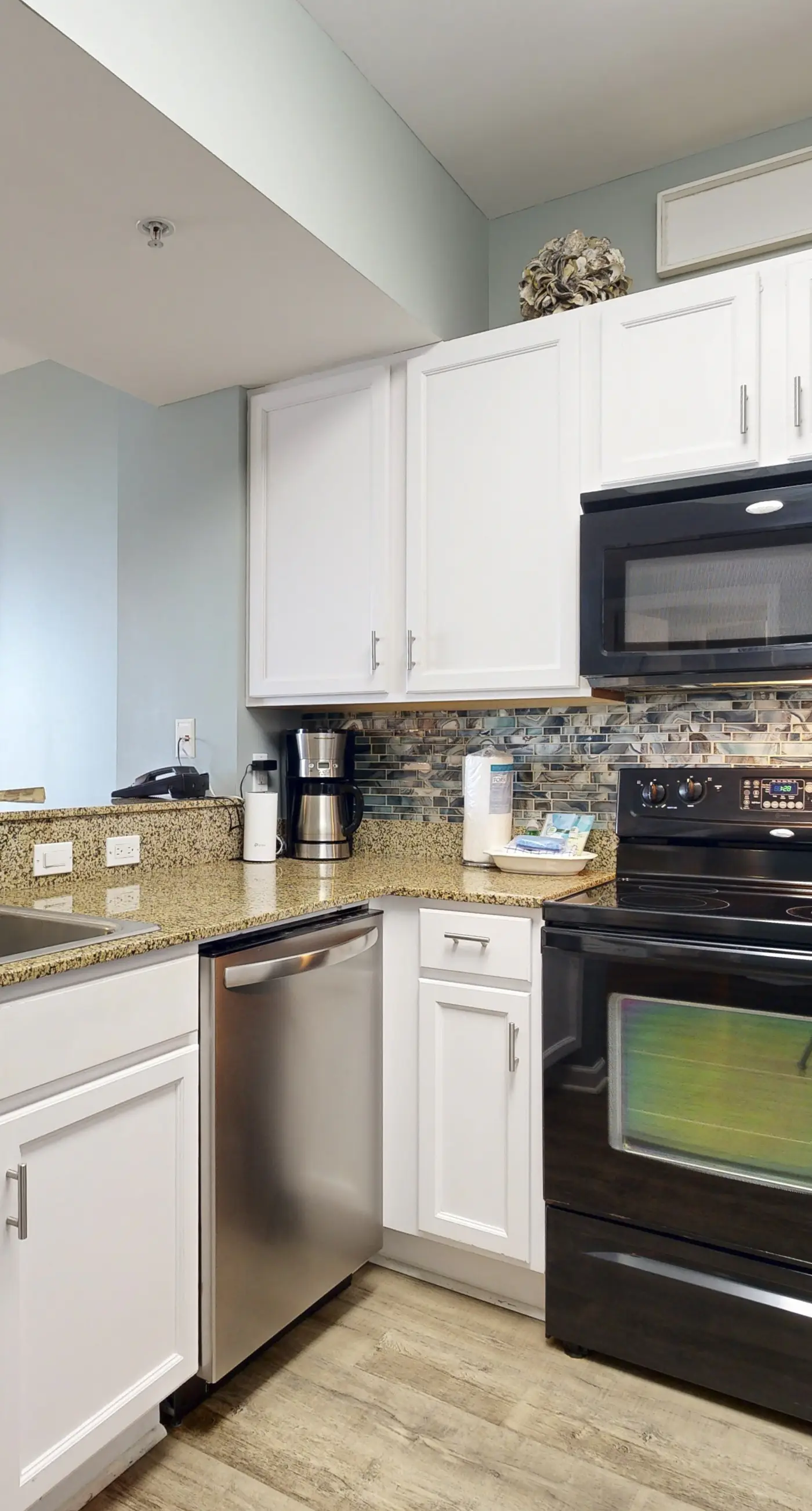 Water-view 11th-floor condo with hot tub, heated pool, tennis, sauna, gym, W/D