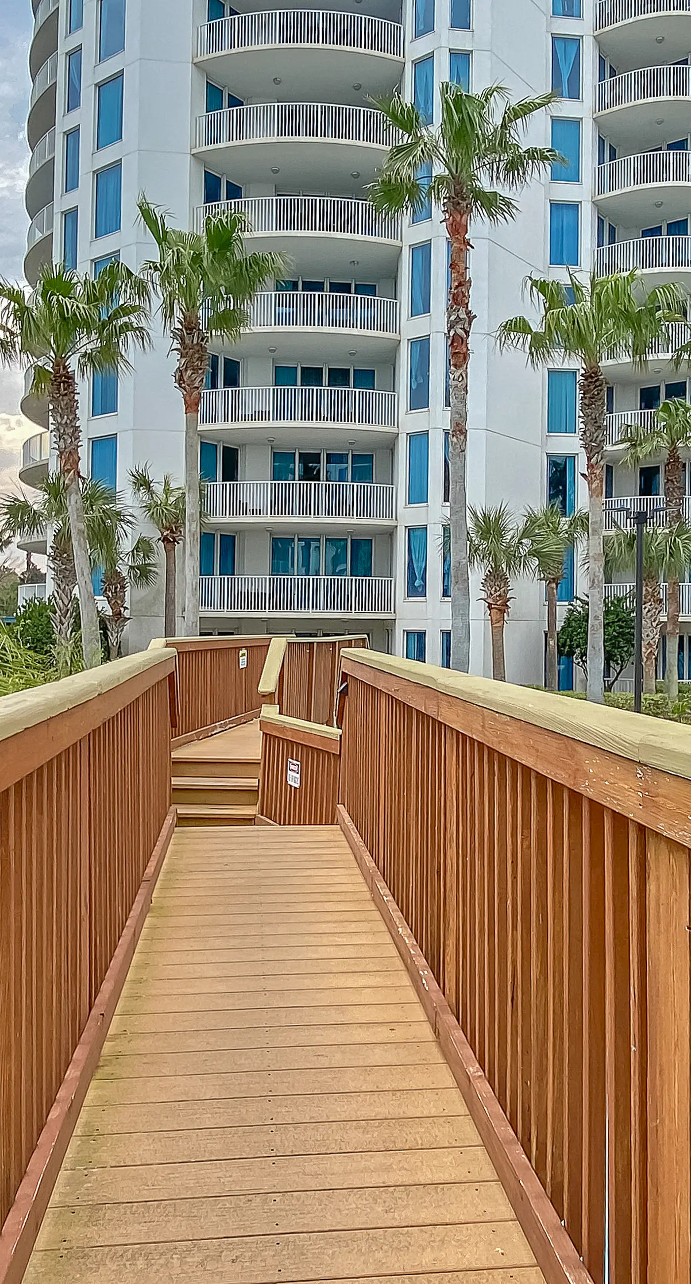 Water-view 11th-floor condo with hot tub, heated pool, tennis, sauna, gym, W/D