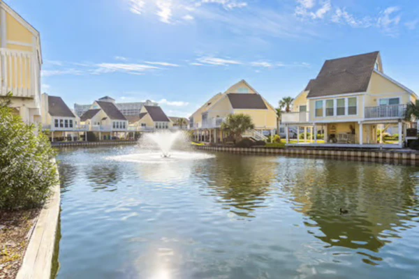 Beachside dog-friendly retreat with pools, hot tub, golf & beach service