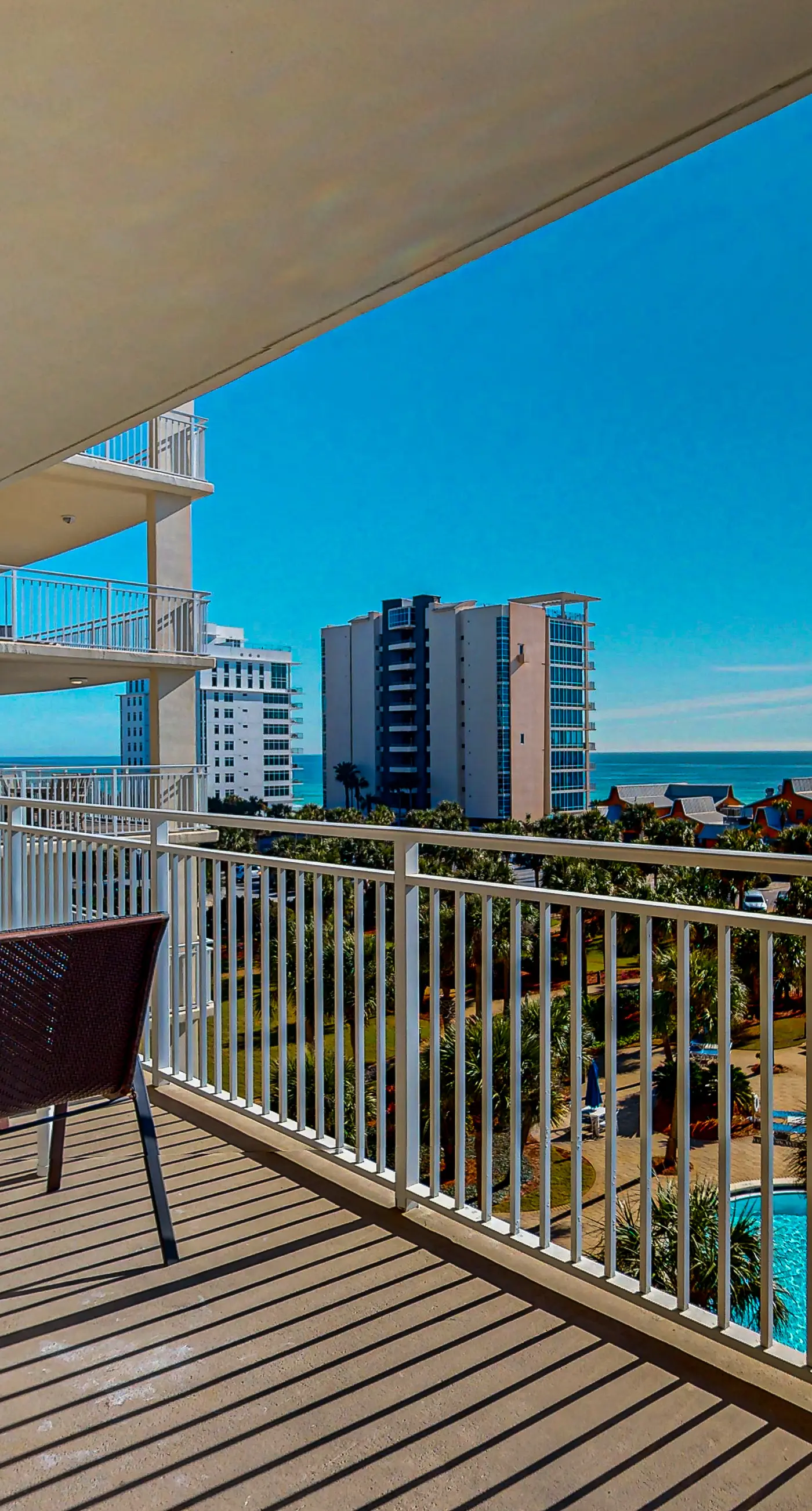 Ocean-view 5th-floor condo with heated outdoor pool, gym, balcony, BBQ area