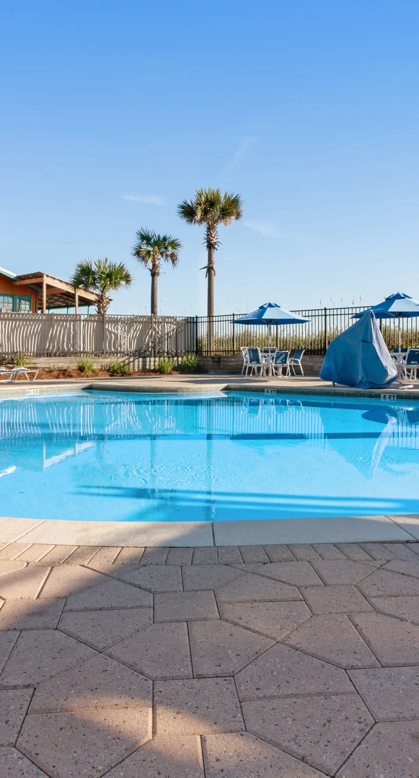 Ocean-view 5th-floor condo with heated outdoor pool, gym, balcony, BBQ area