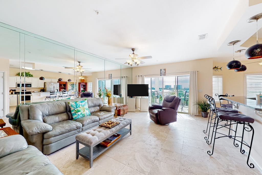 Dog-friendly waterfront & gated condo with pool access, balcony, AC, & W/D