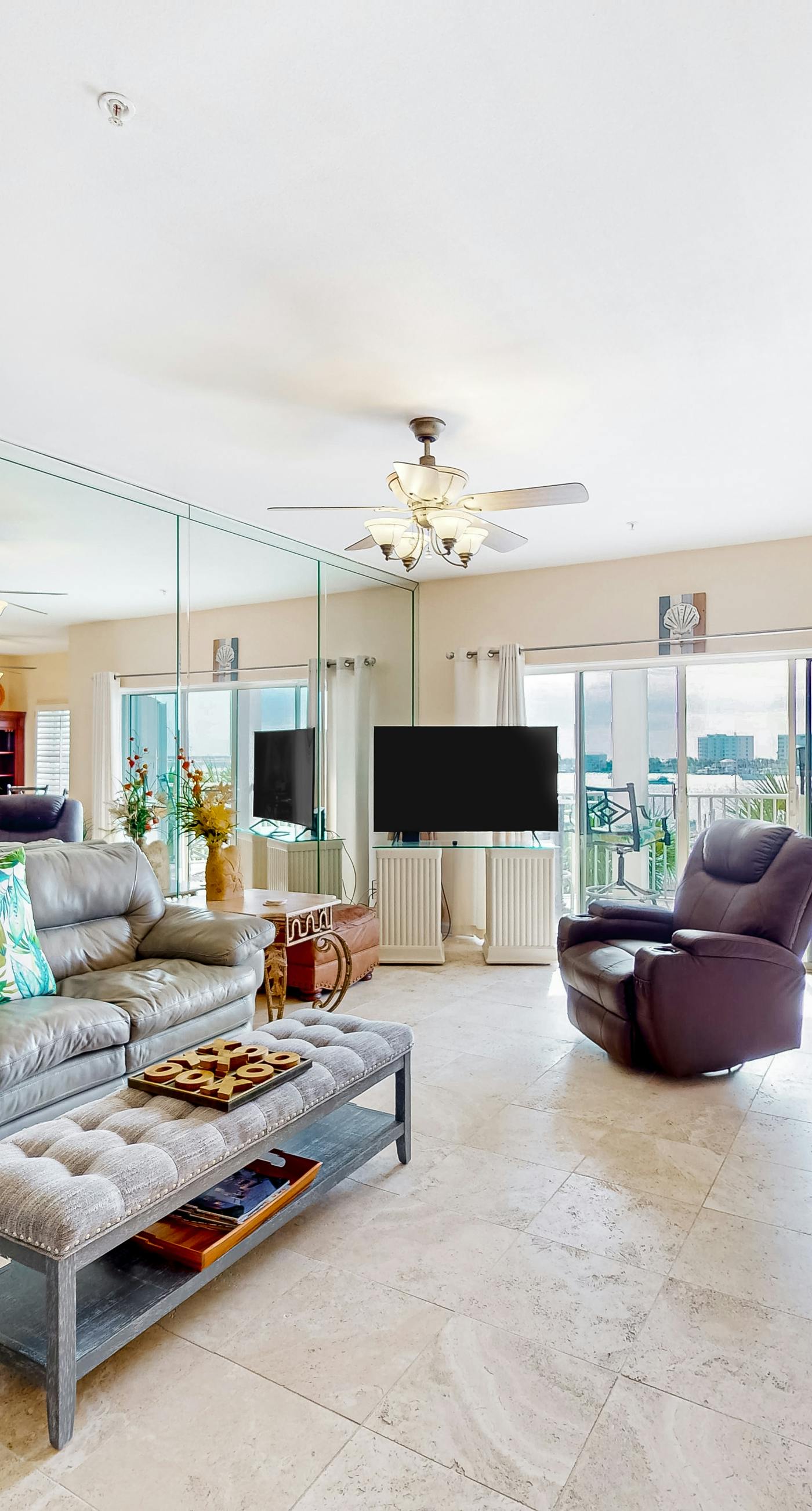 Dog-friendly waterfront & gated condo with pool access, balcony, AC, & W/D