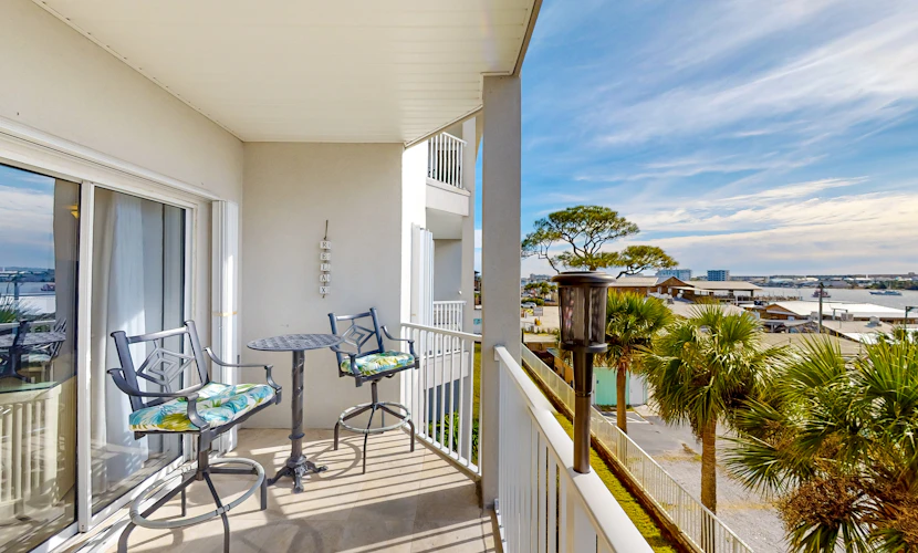 Dog-friendly waterfront & gated condo with pool access, balcony, AC, & W/D