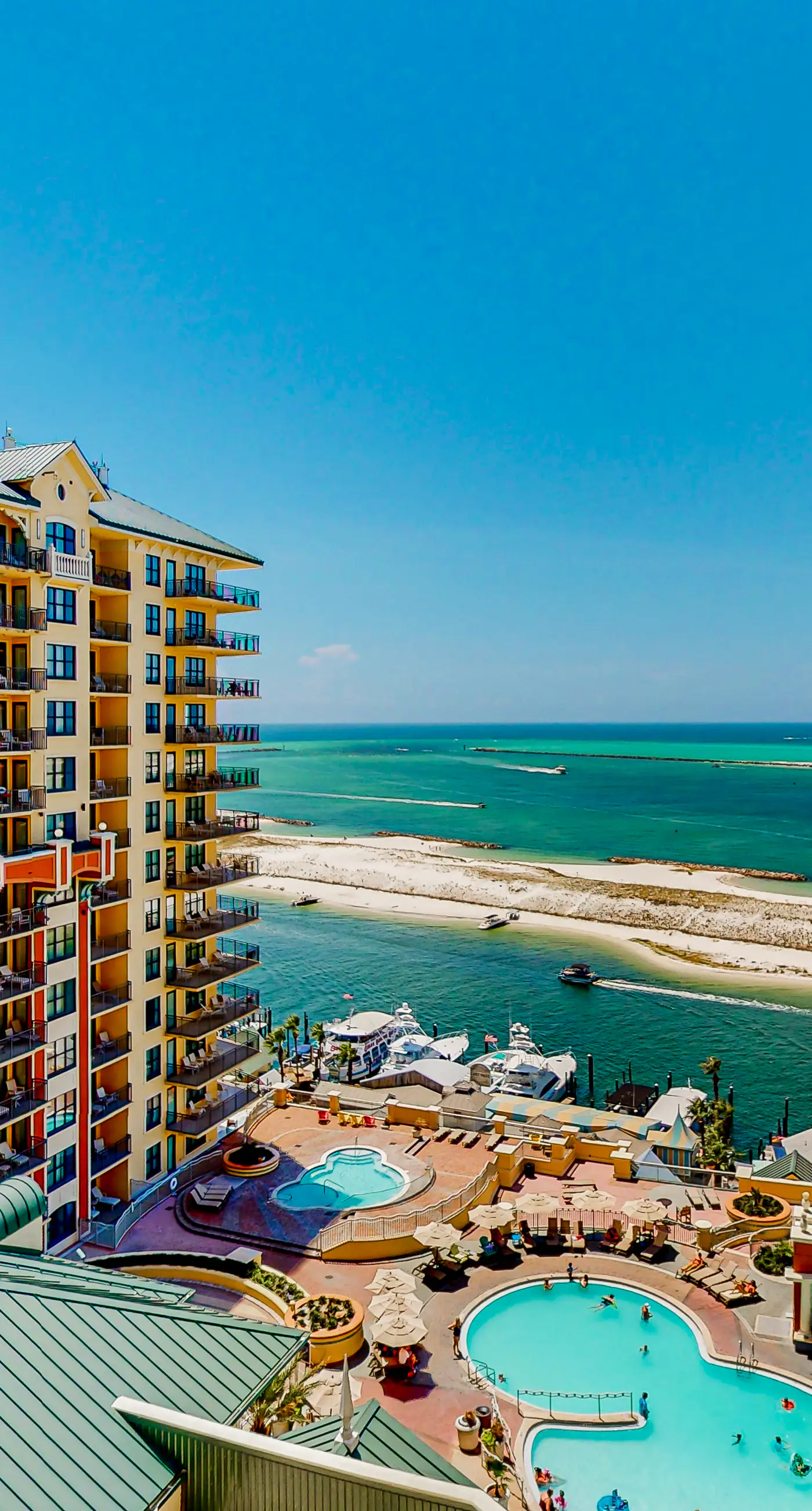 Gulf-view condo with beach access, pool, hot tub, sauna, & private balcony