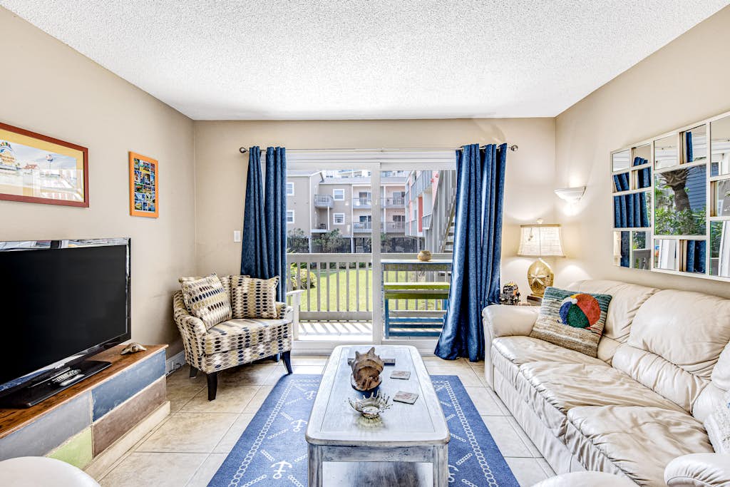 Convenient condo near beach with pool, balcony, & W/D - snowbird-friendly