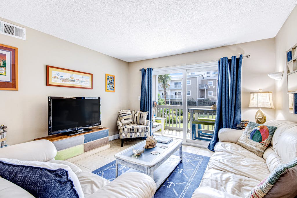 Convenient condo near beach with pool, balcony, & W/D - snowbird-friendly