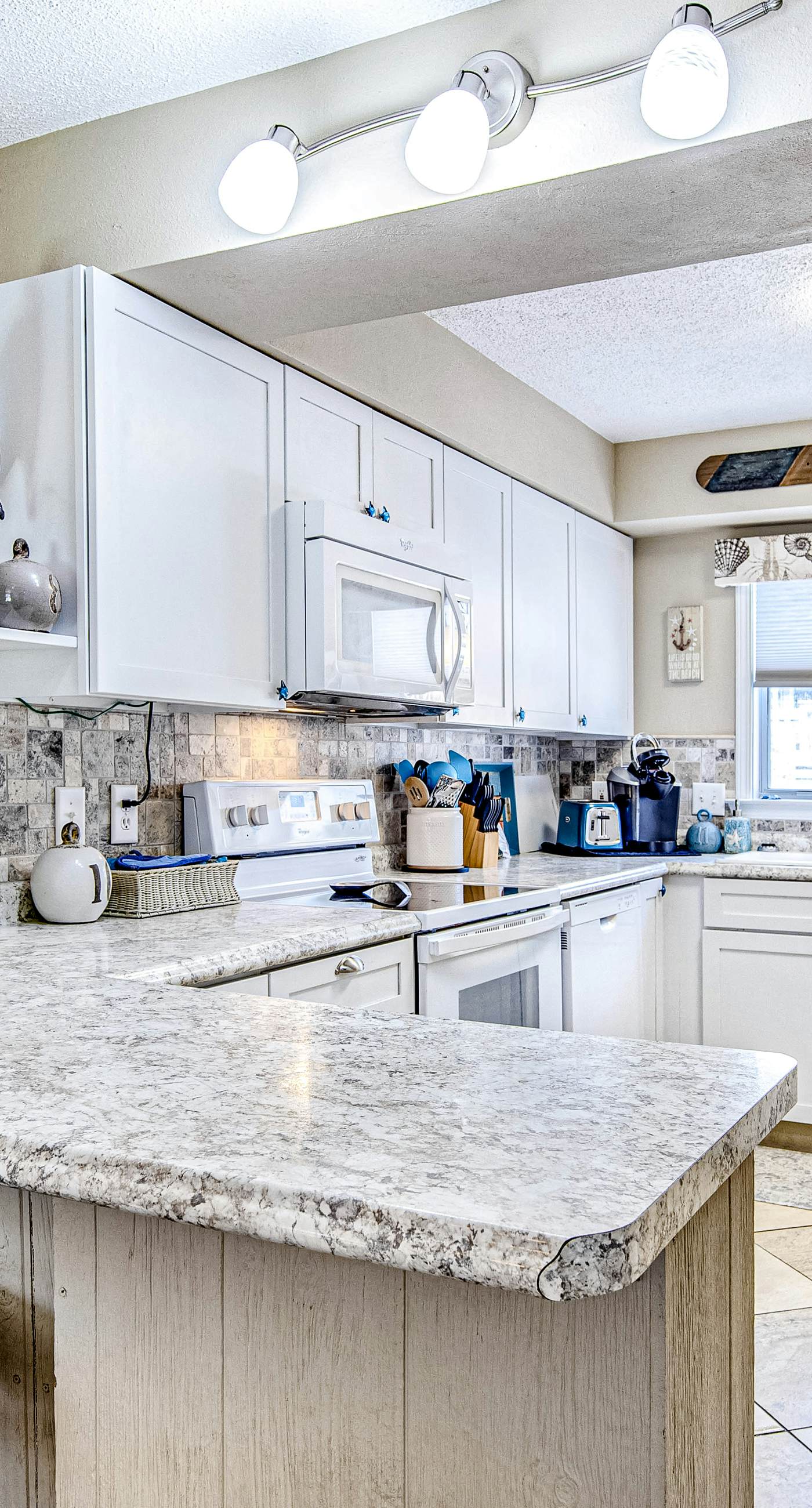 Convenient condo near beach with pool, balcony, & W/D - snowbird-friendly