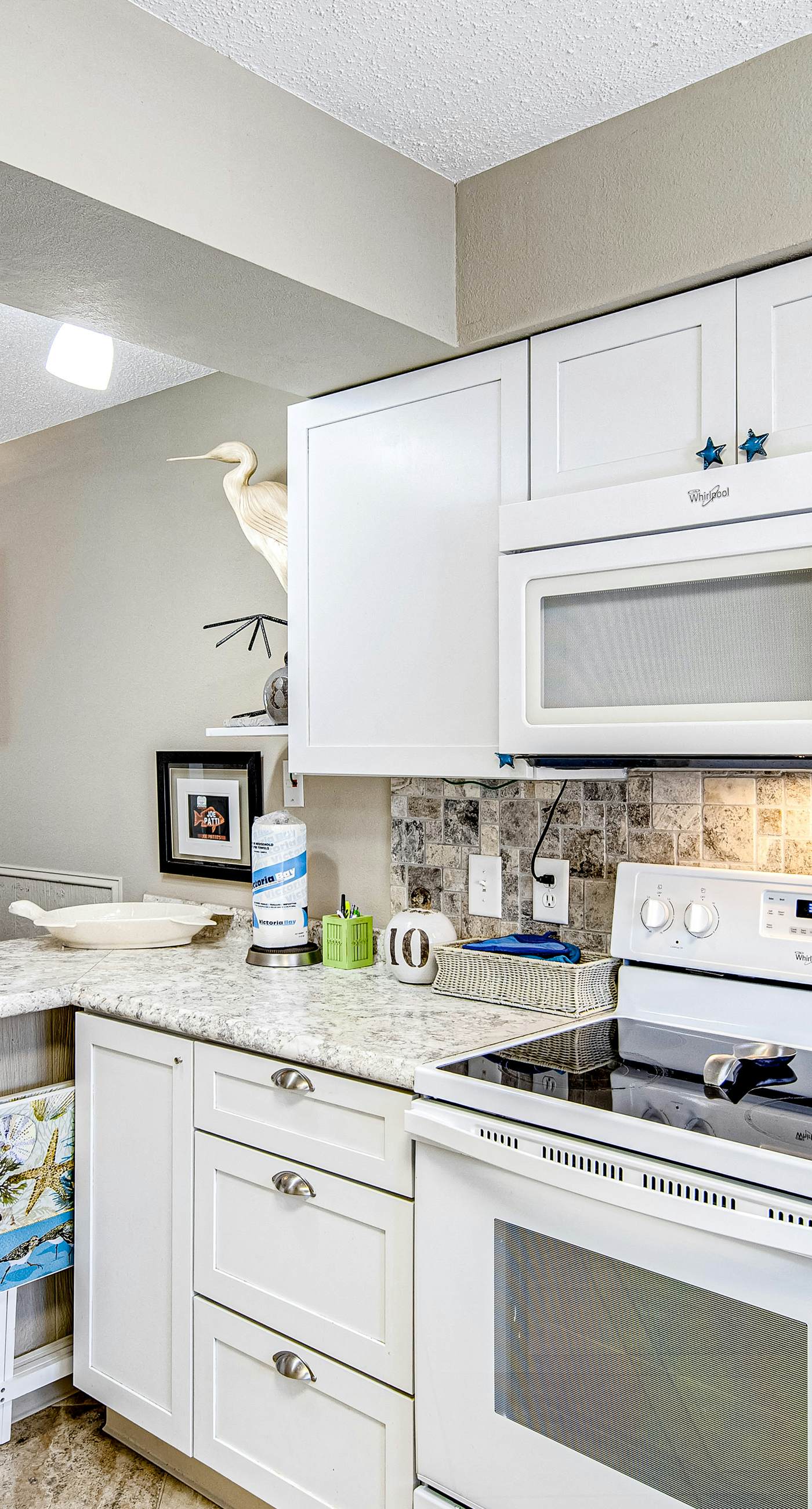 Convenient condo near beach with pool, balcony, & W/D - snowbird-friendly