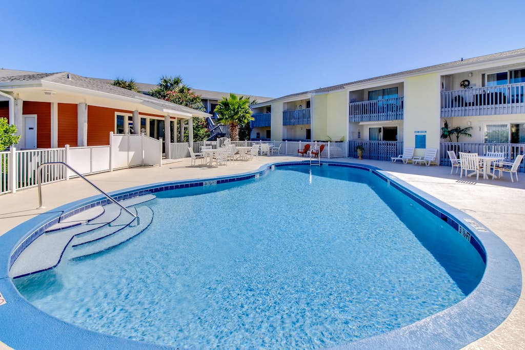 Convenient condo near beach with pool, balcony, & W/D - snowbird-friendly