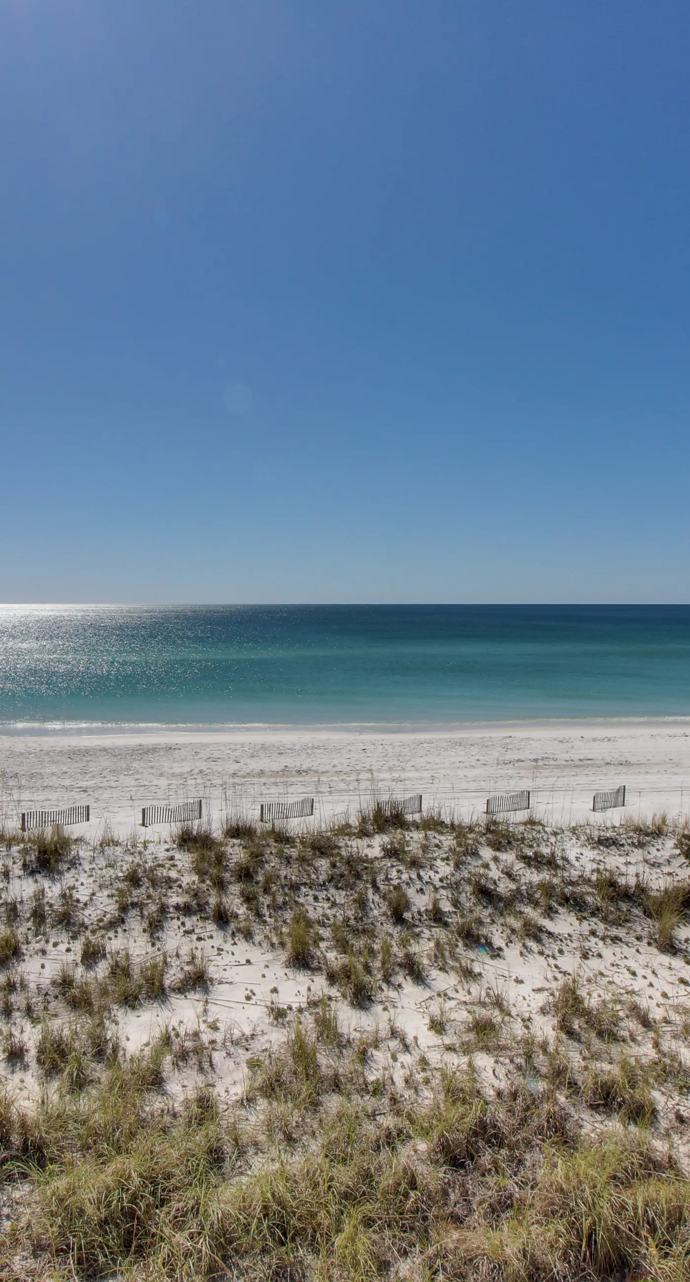 Cozy coastal condo with pool, fast WiFi, central AC, & easy beach access