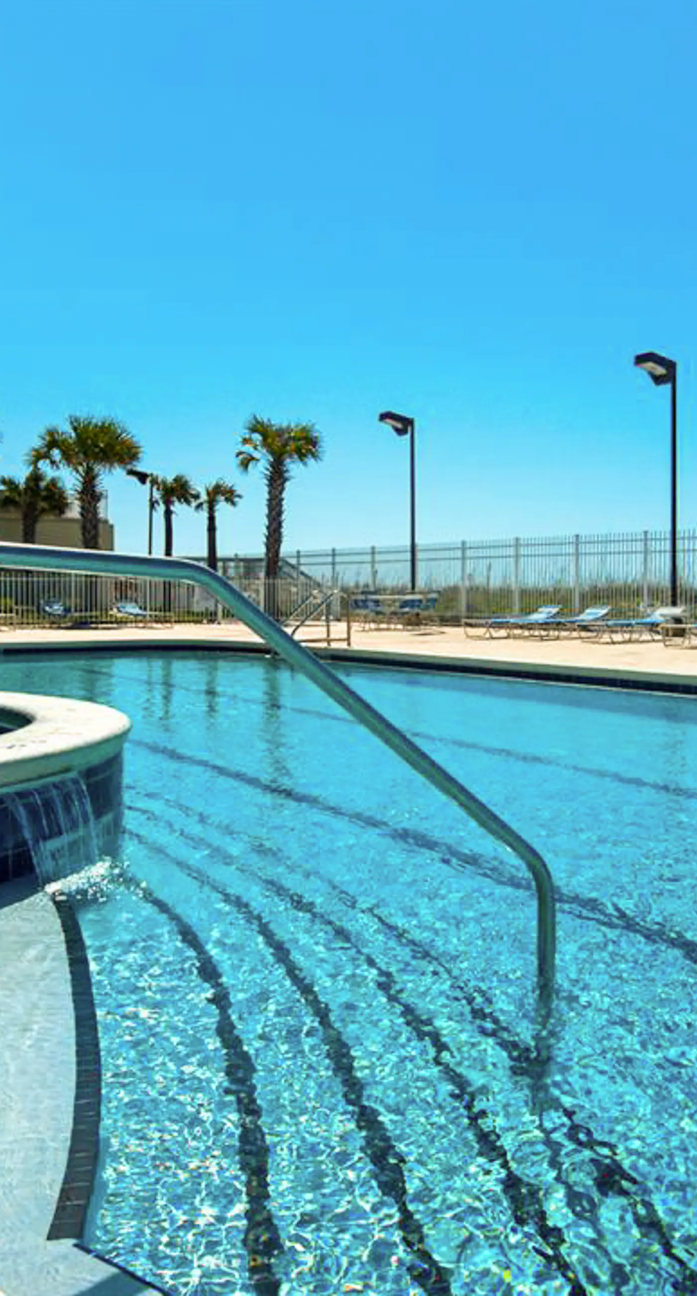 Family-friendly, beachfront condo w/shared outdoor pool, hot tub, & beach access