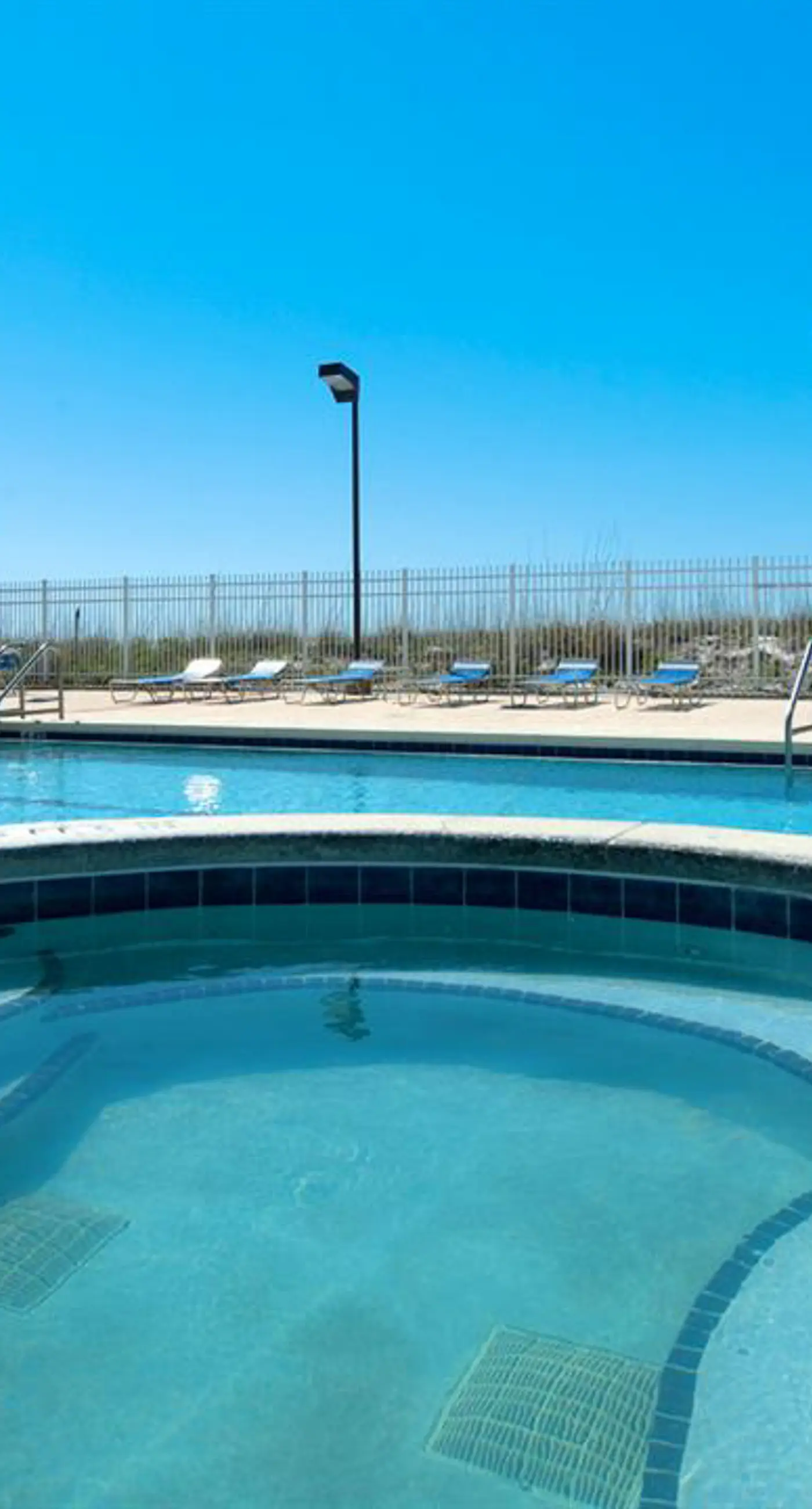 Family-friendly, beachfront condo w/shared outdoor pool, hot tub, & beach access
