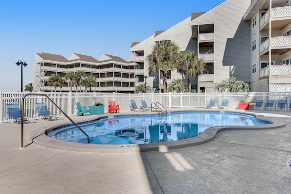 Condo with partial bay view, onsite fishing dock, beach access, & shared pool