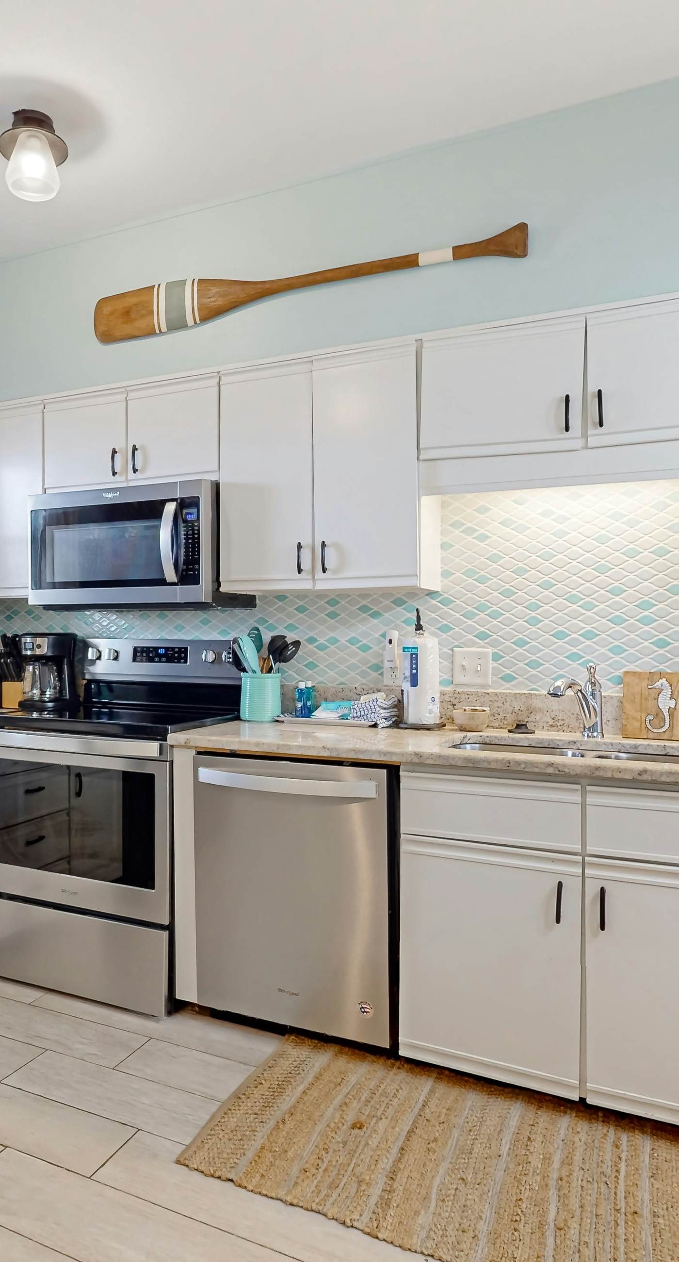 Condo with partial bay view, onsite fishing dock, beach access, & shared pool