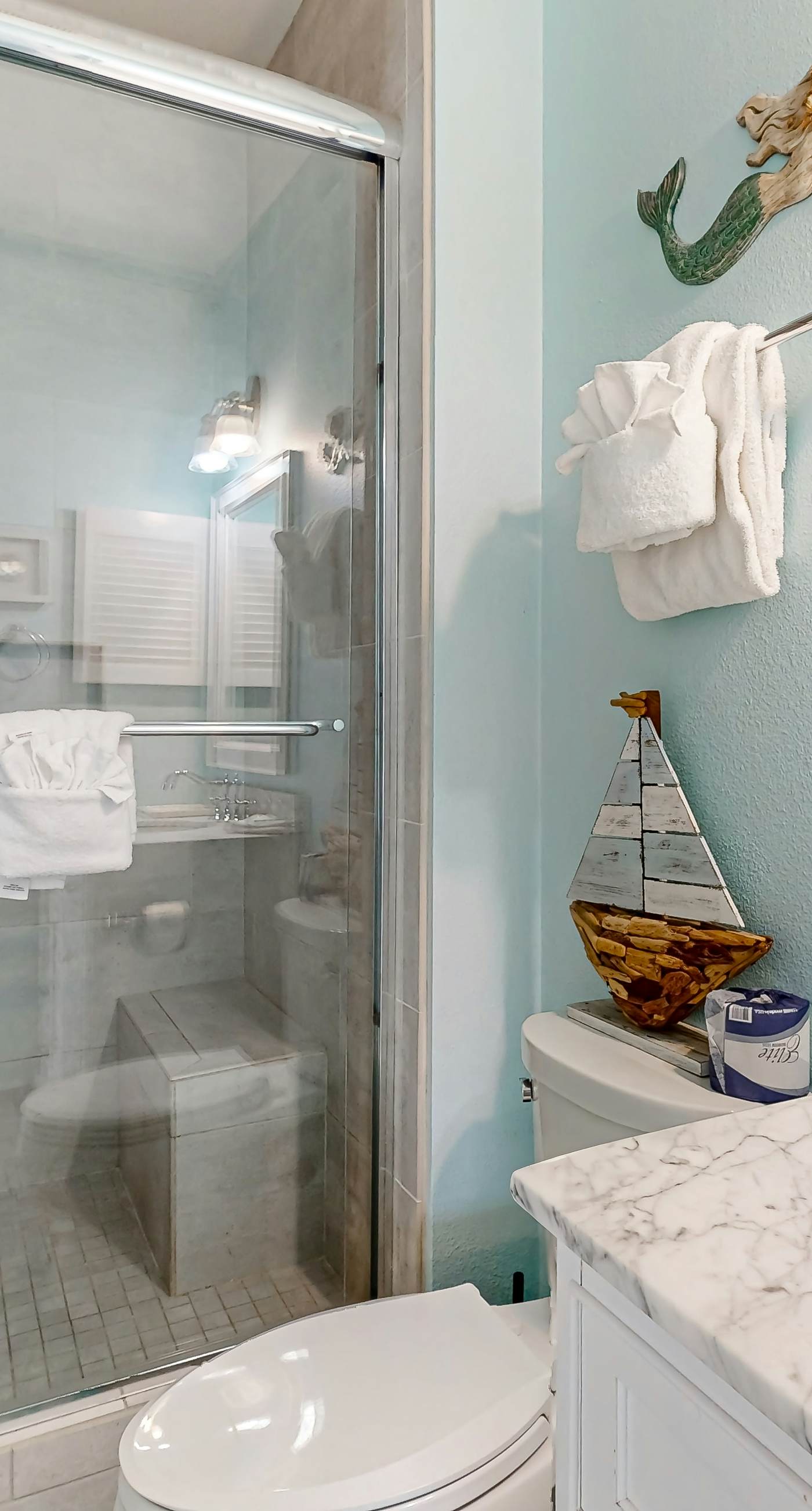 Condo with partial bay view, onsite fishing dock, beach access, & shared pool