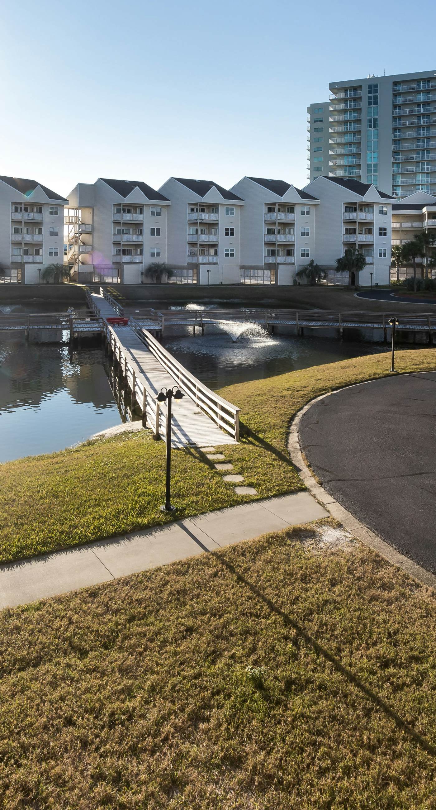Condo with partial bay view, onsite fishing dock, beach access, & shared pool