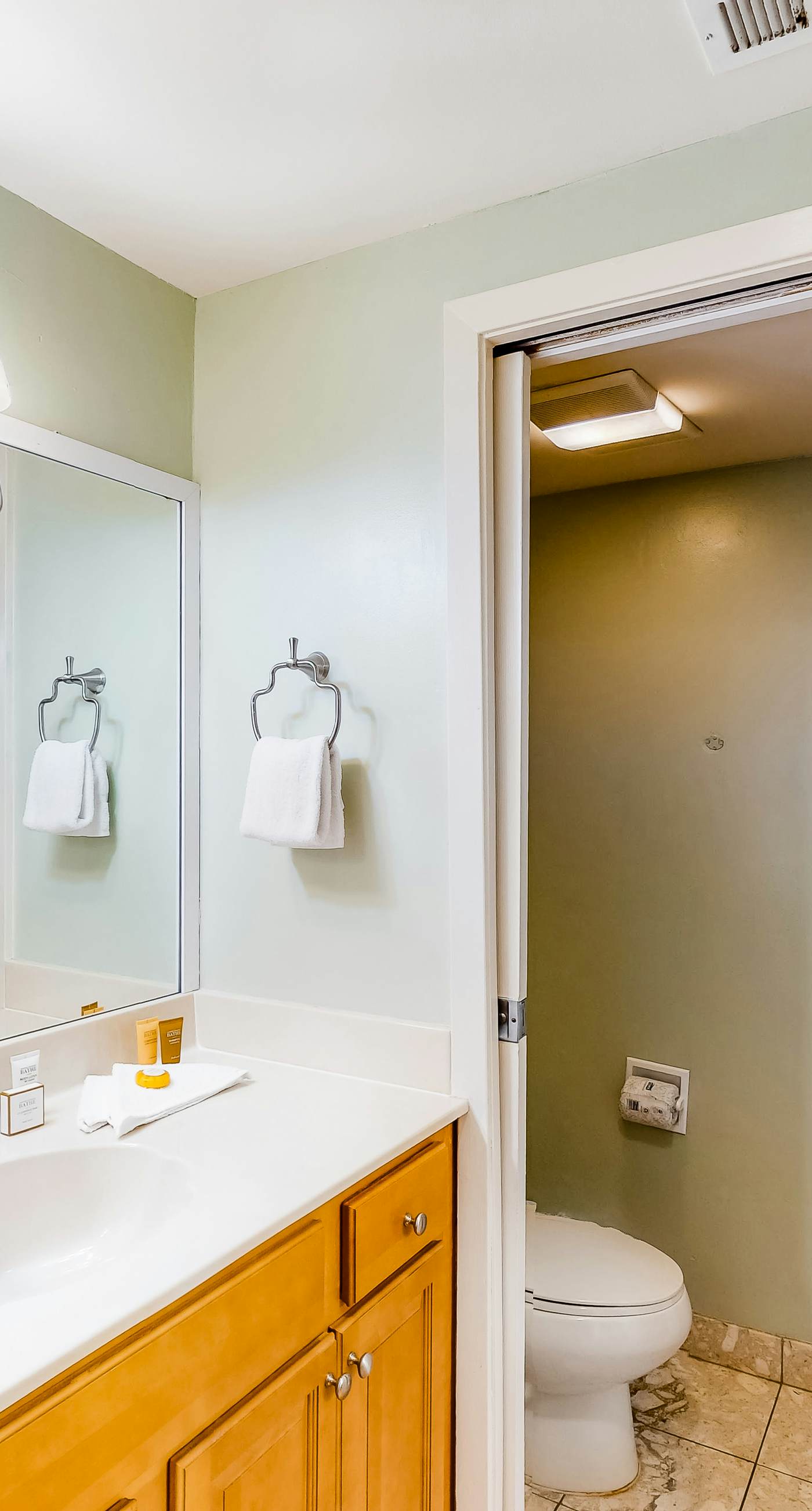 Inviting condo with bay & ocean views, & pool - steps to the beach