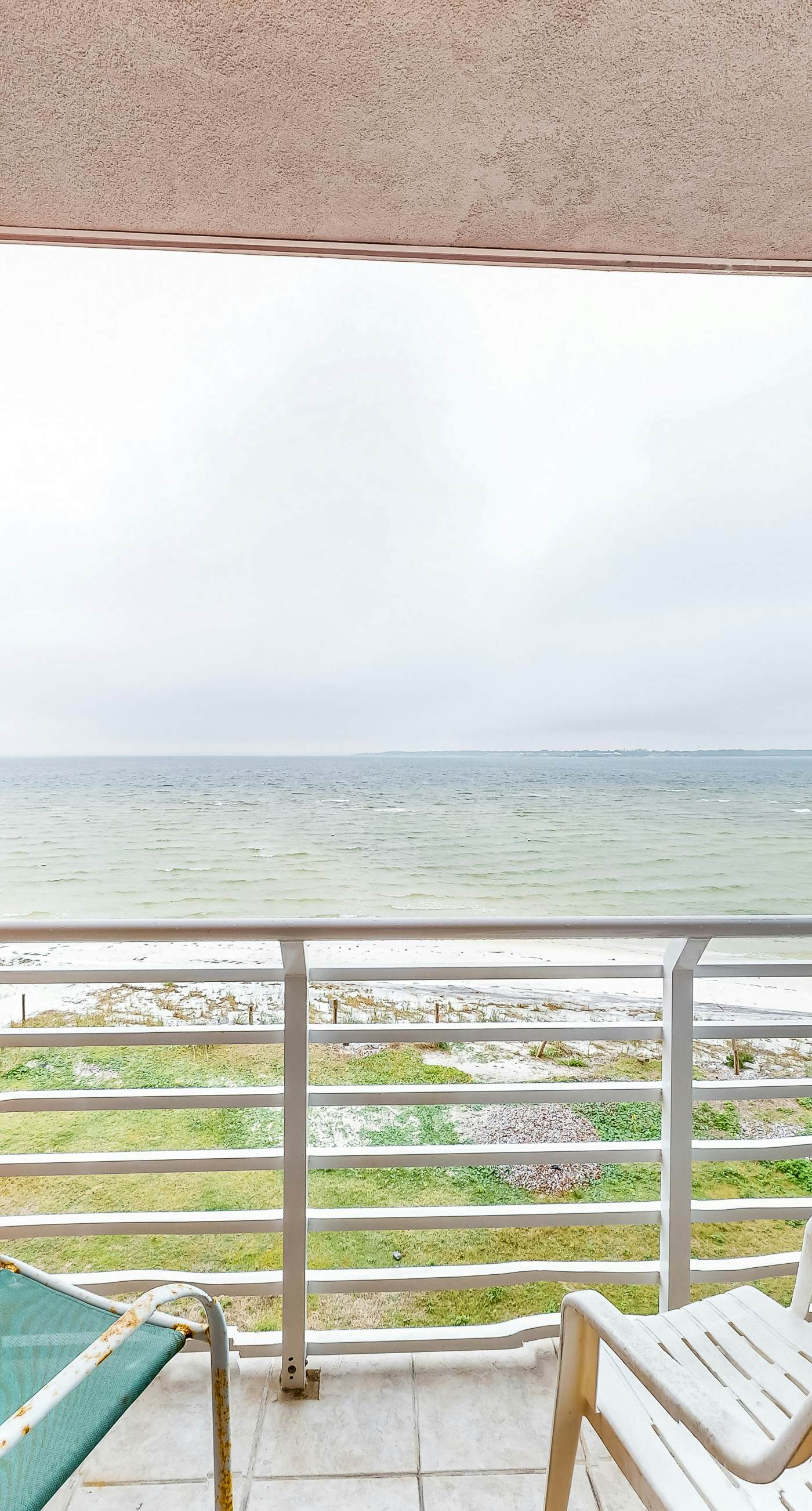 Inviting condo with bay & ocean views, & pool - steps to the beach