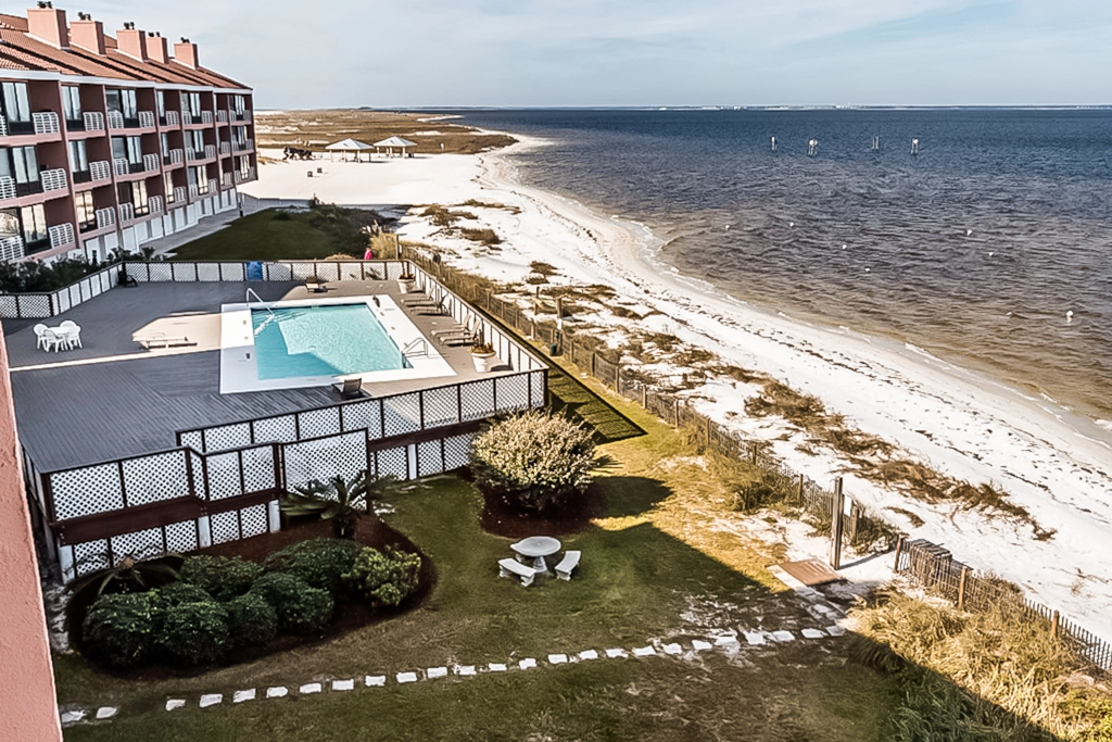Inviting condo with bay & ocean views, & pool - steps to the beach