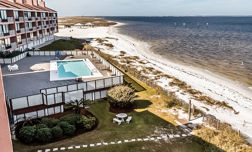 Inviting condo with bay & ocean views, & pool - steps to the beach