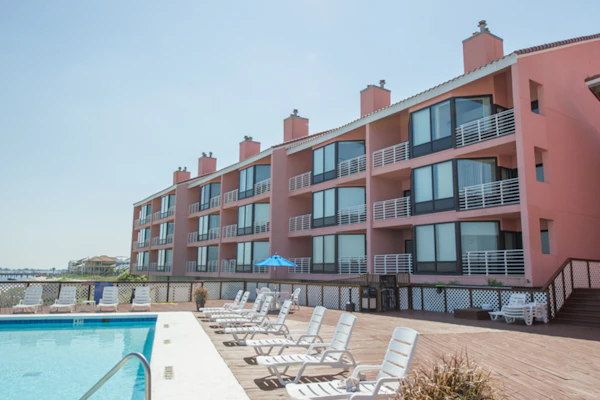 Inviting condo with bay & ocean views, & pool - steps to the beach
