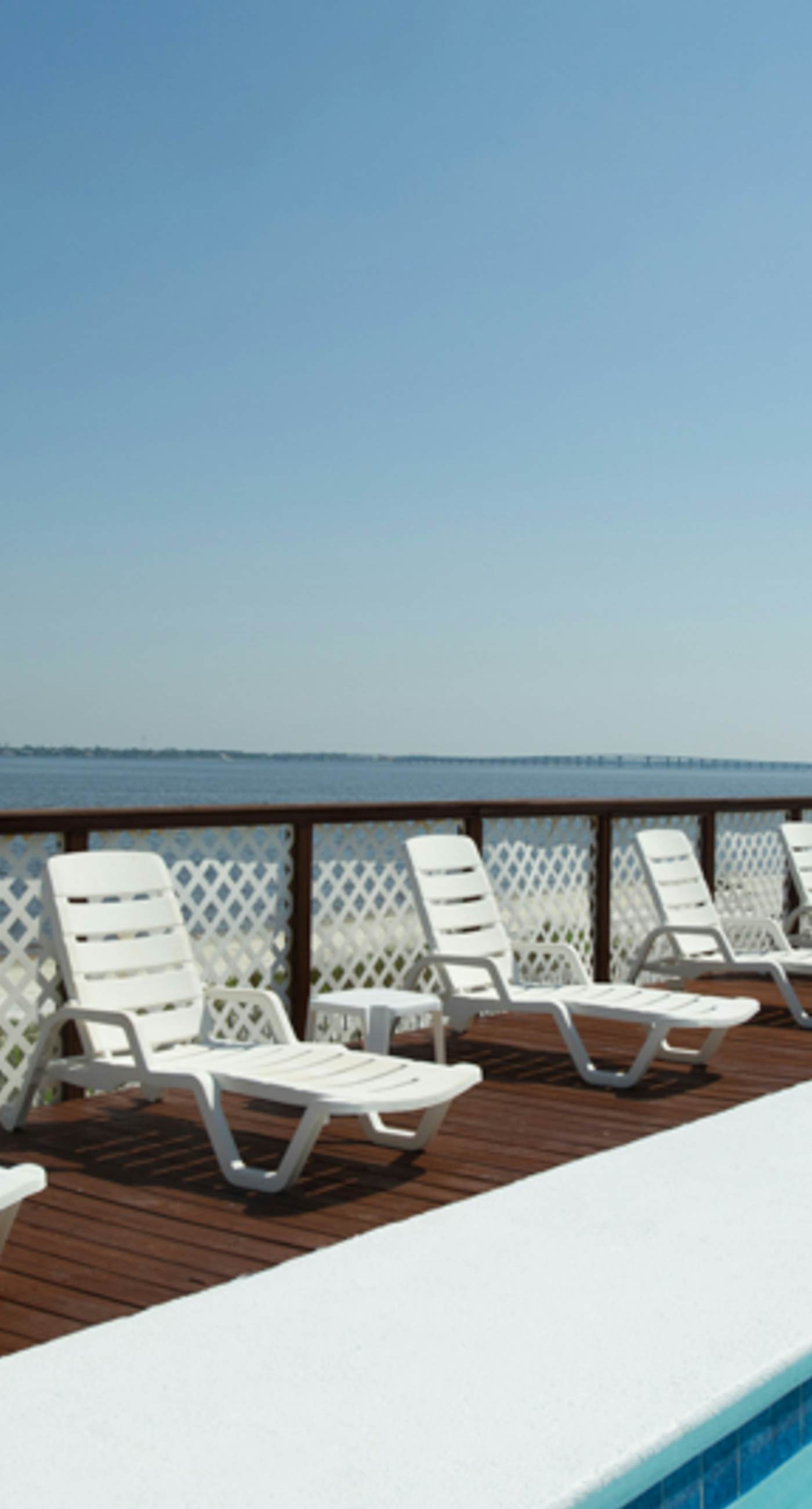 Inviting condo with bay & ocean views, & pool - steps to the beach